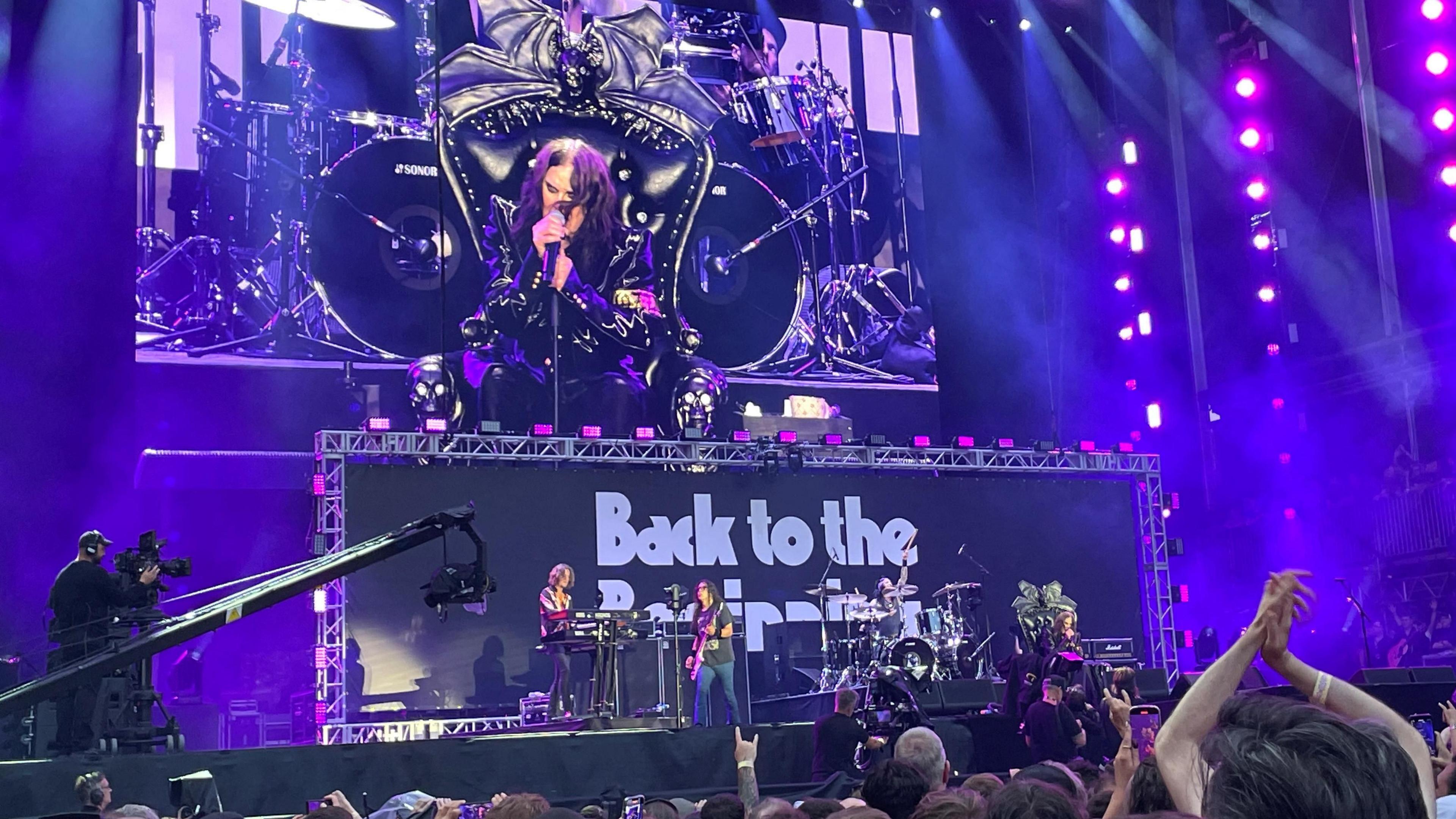 Ozzy Osbourne is seen on a screen as he performs at the Black Sabbath's farewell show