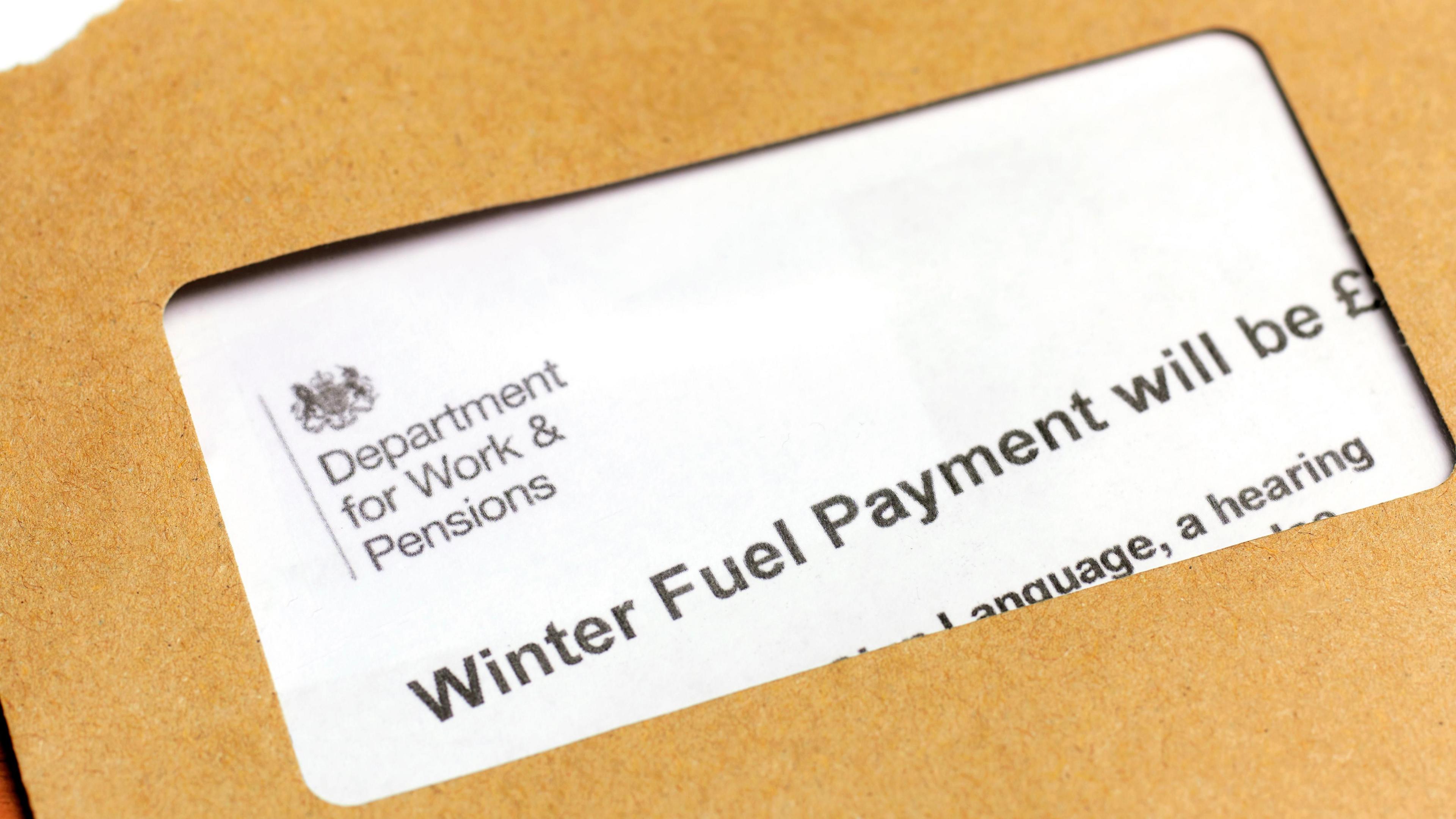 Winter fuel letter from Department of Work and Pensions. Letter is folded, so only wording visible is "Winter Fuel Payment will be".  The letter is on top of a brown envelope.