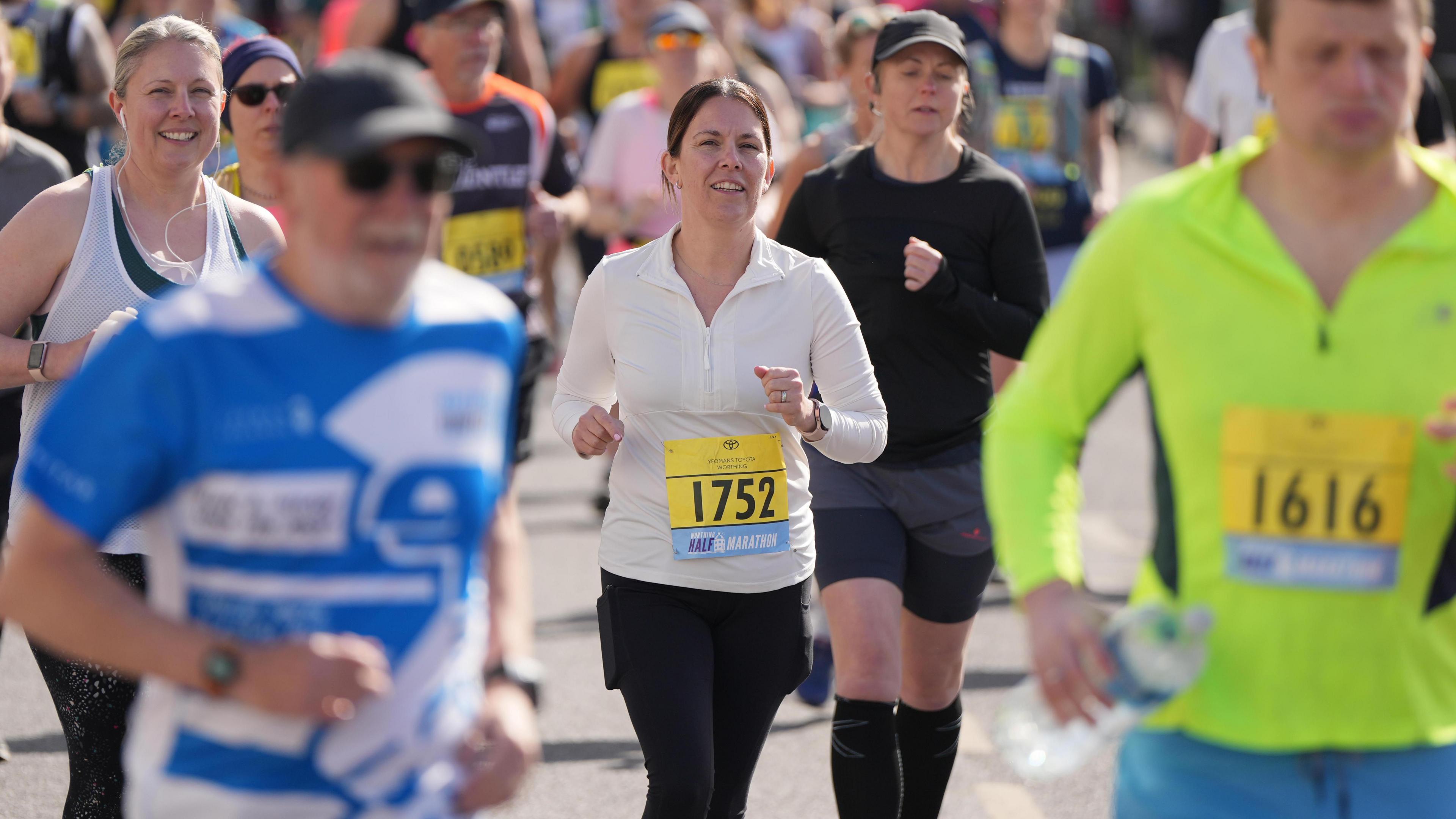 Runners in action at the Worthing Half Marathon 2025.
