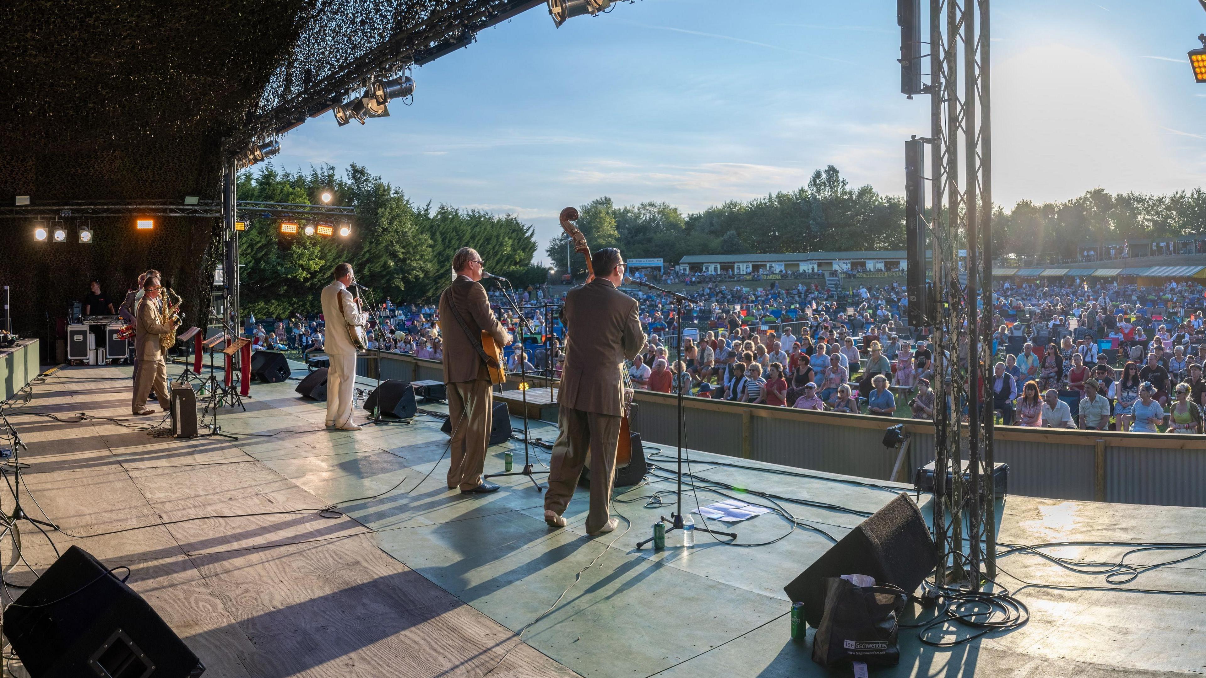 A band performs on stage at Twinwood Festival