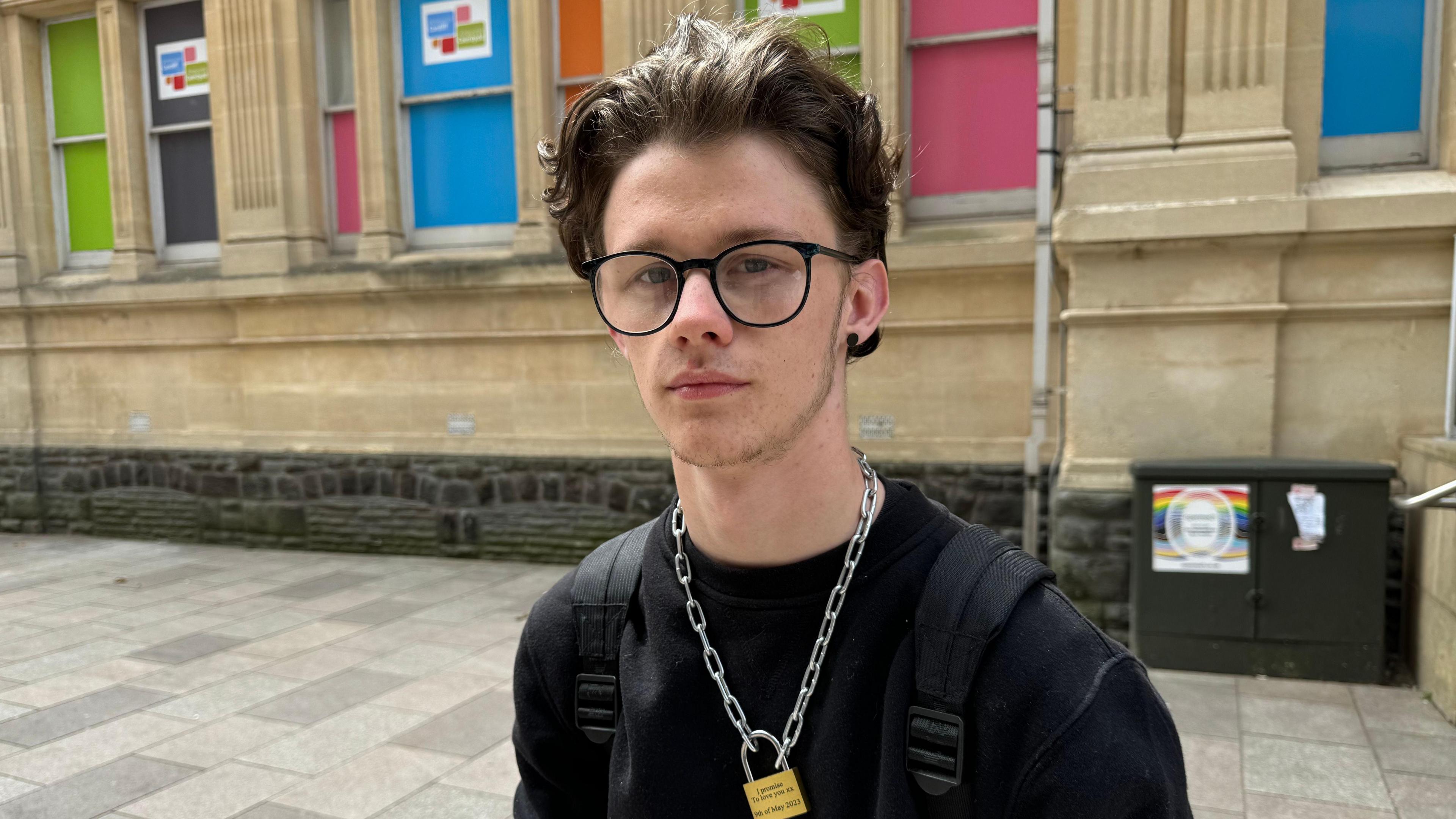 Matthew standing on a city street