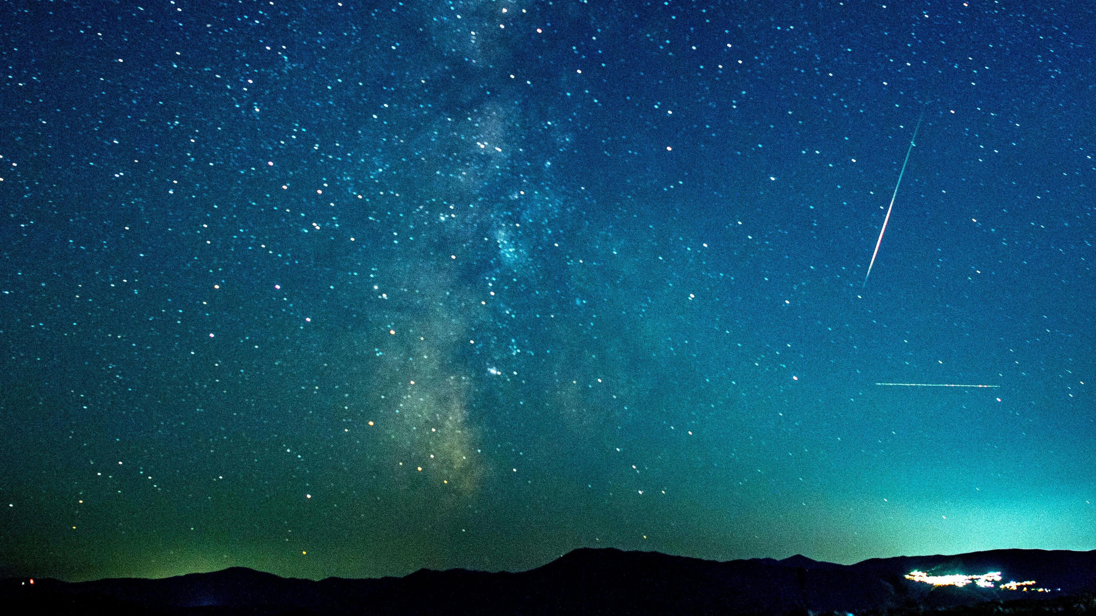 A meteor streaks through the night sky over the lake of Kozjak in North Macedonia.