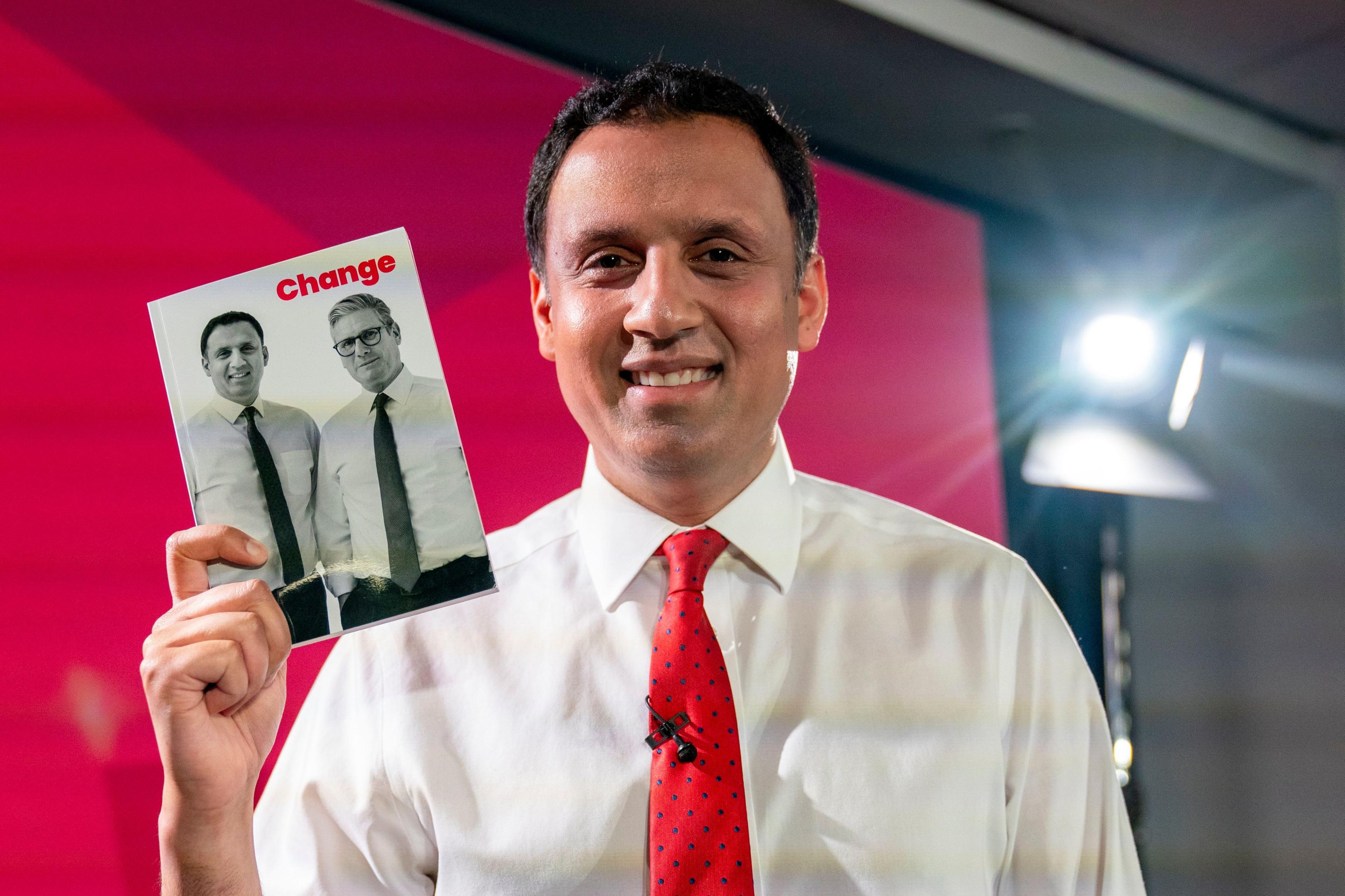 Anas Sarwar holding the Scottish Labour manifesto