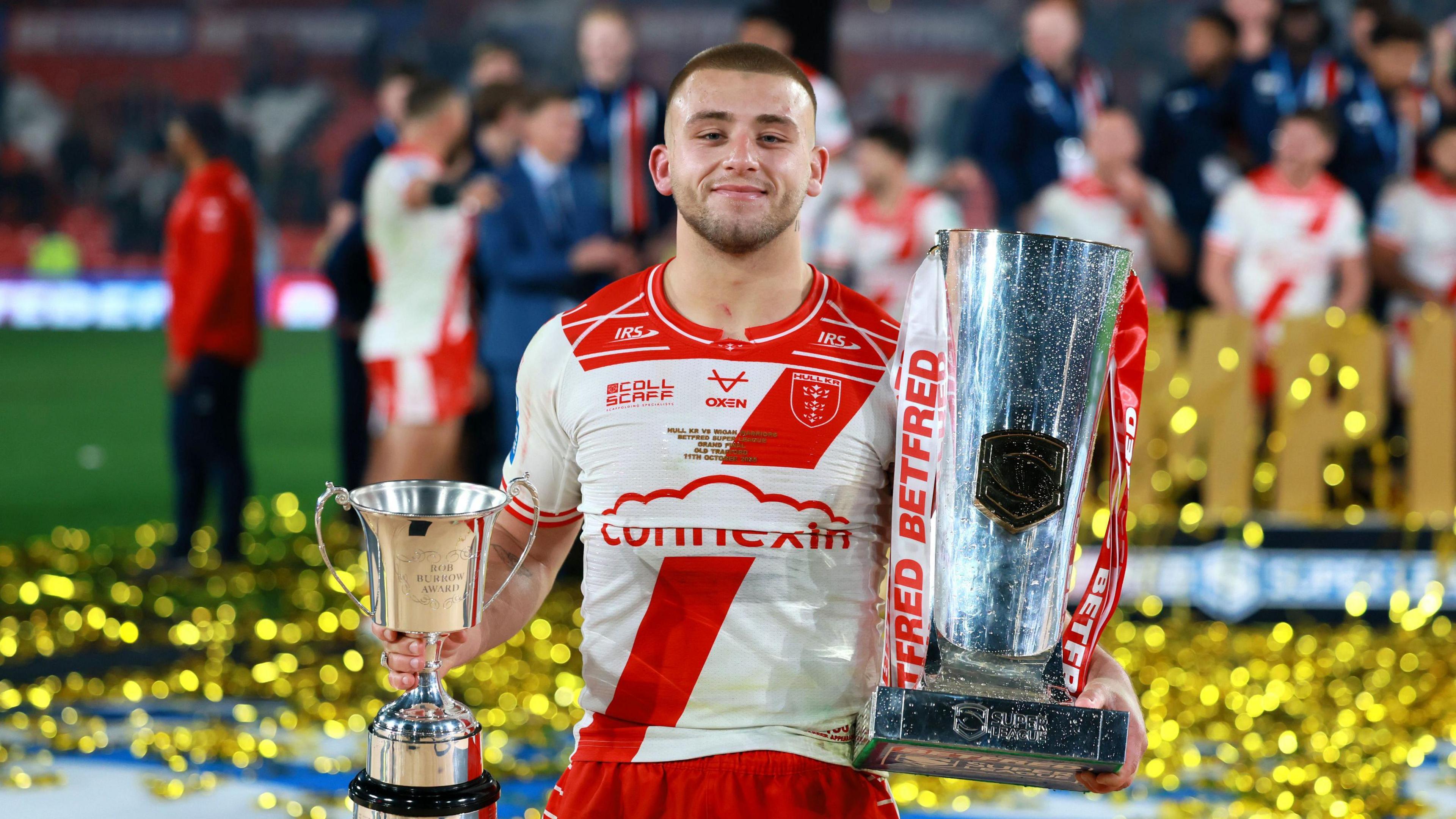 Hull KR's Mikey Lewis with the Super League trophy and the Rob Burrow Award for man of the match