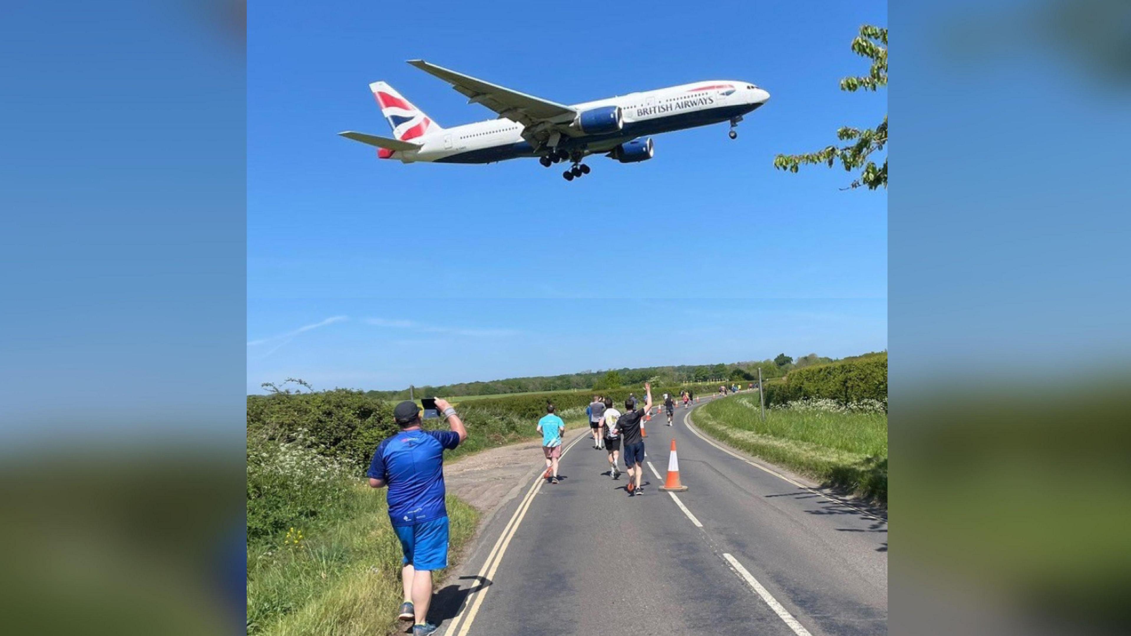 A plane passes above the runners during last year's event