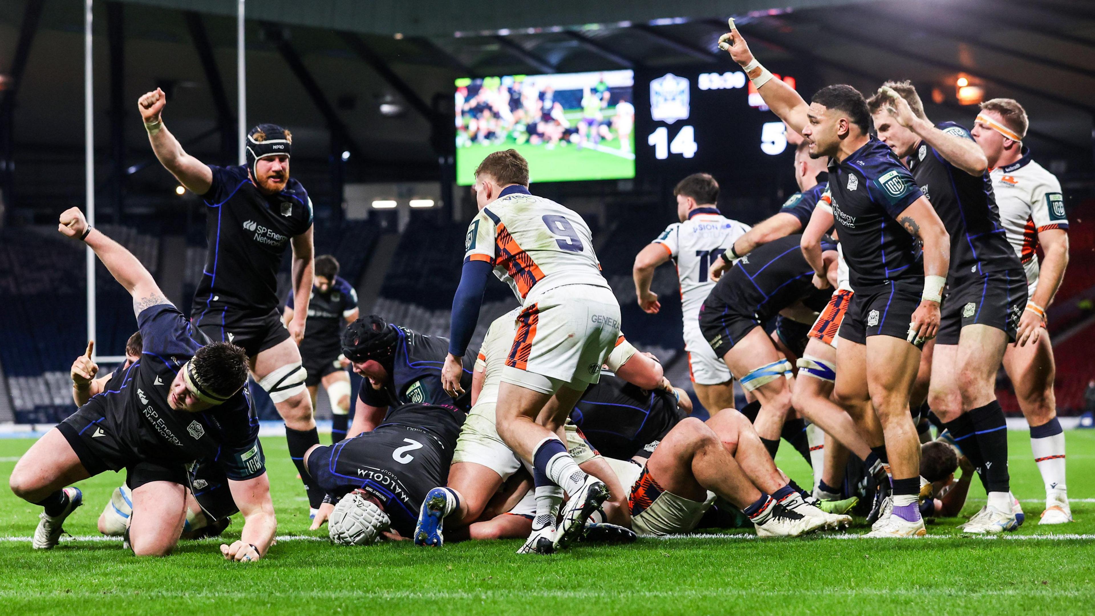Glasgow celebrate scoring a try against Edinburgh at Hampden