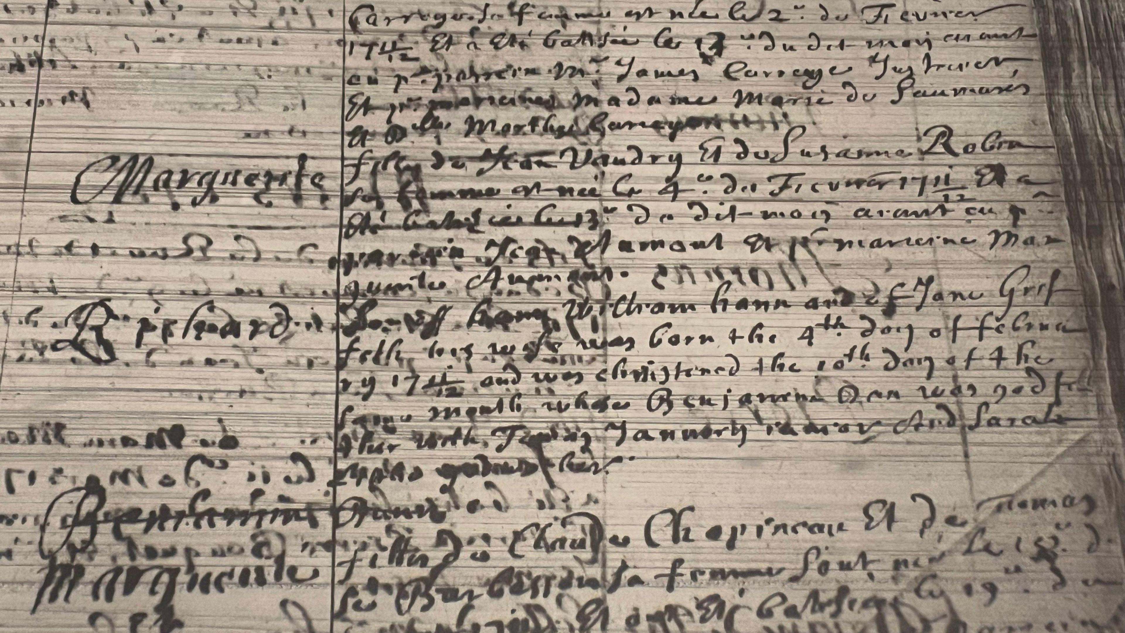 A hard to read baptism record, written in cursive handwriting on parchmant.