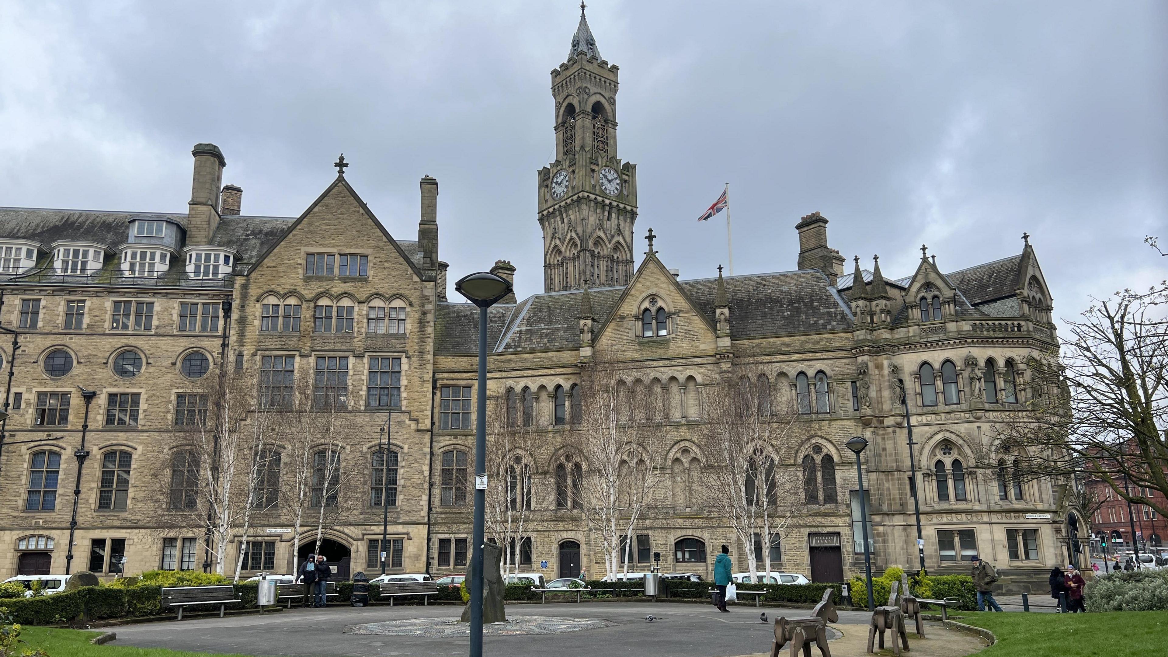 Bradford City Hall, a grand 19th Century building pictured from the neighbouring public gardens.