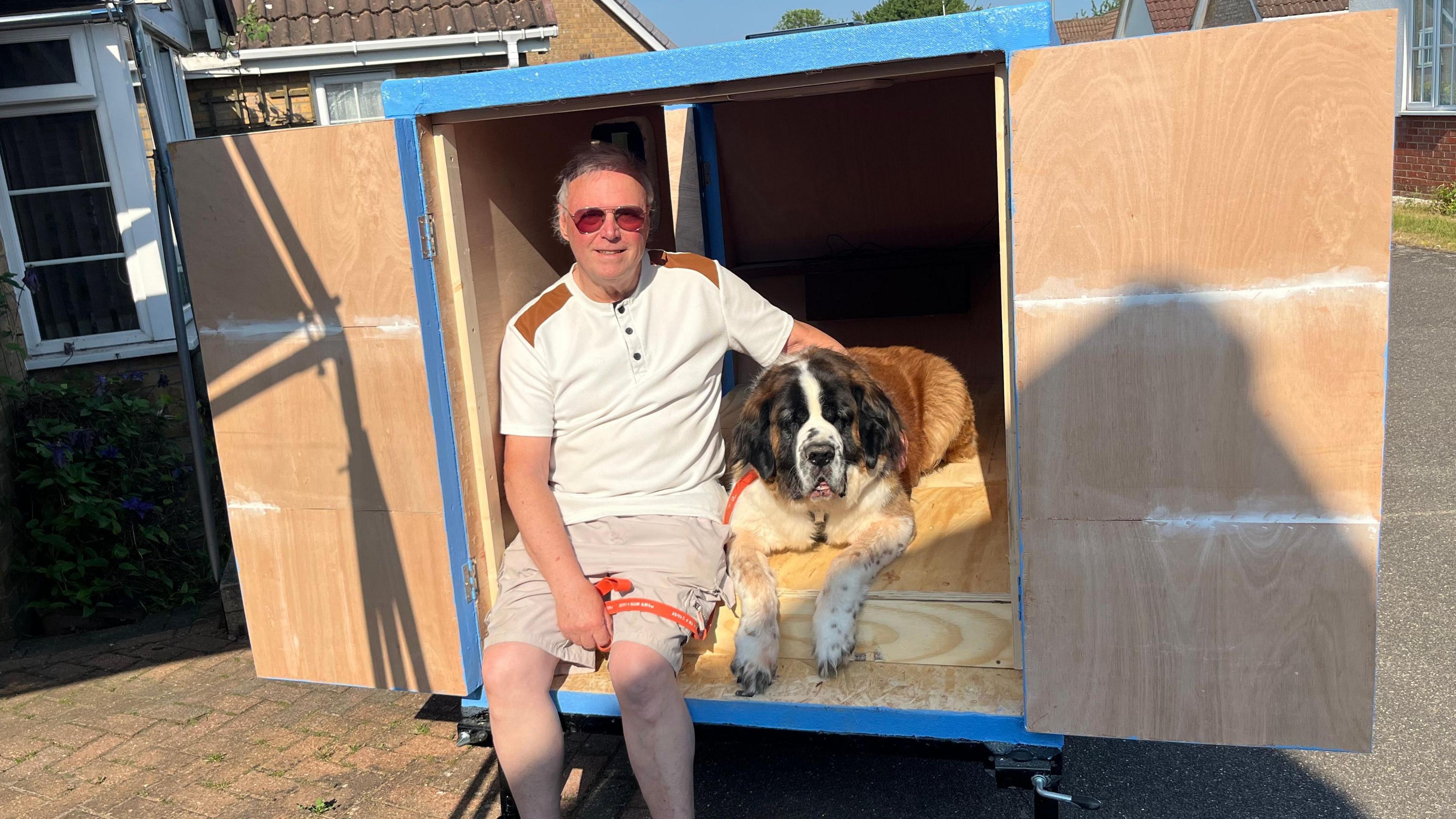 Alan with Louis in the caravan he is making 