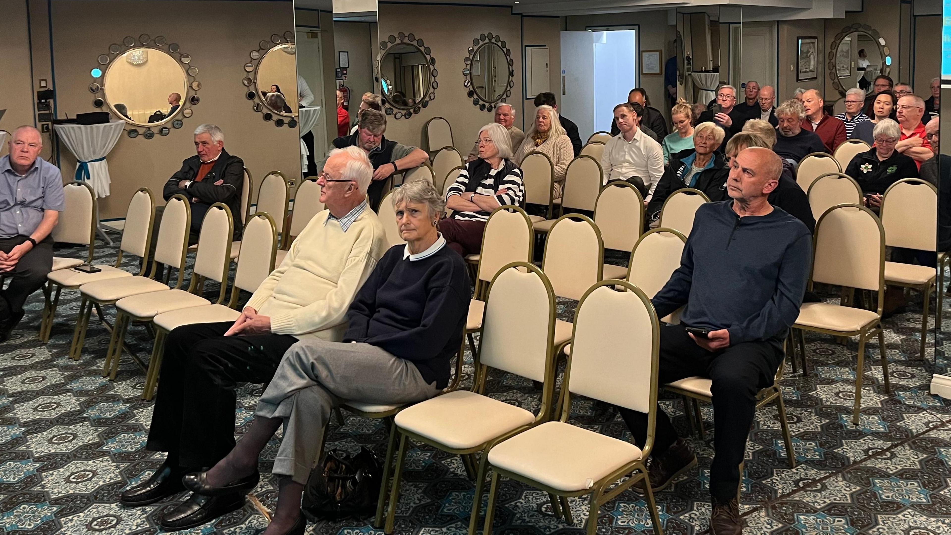 People attending a public meeting at the Duke of Richmond