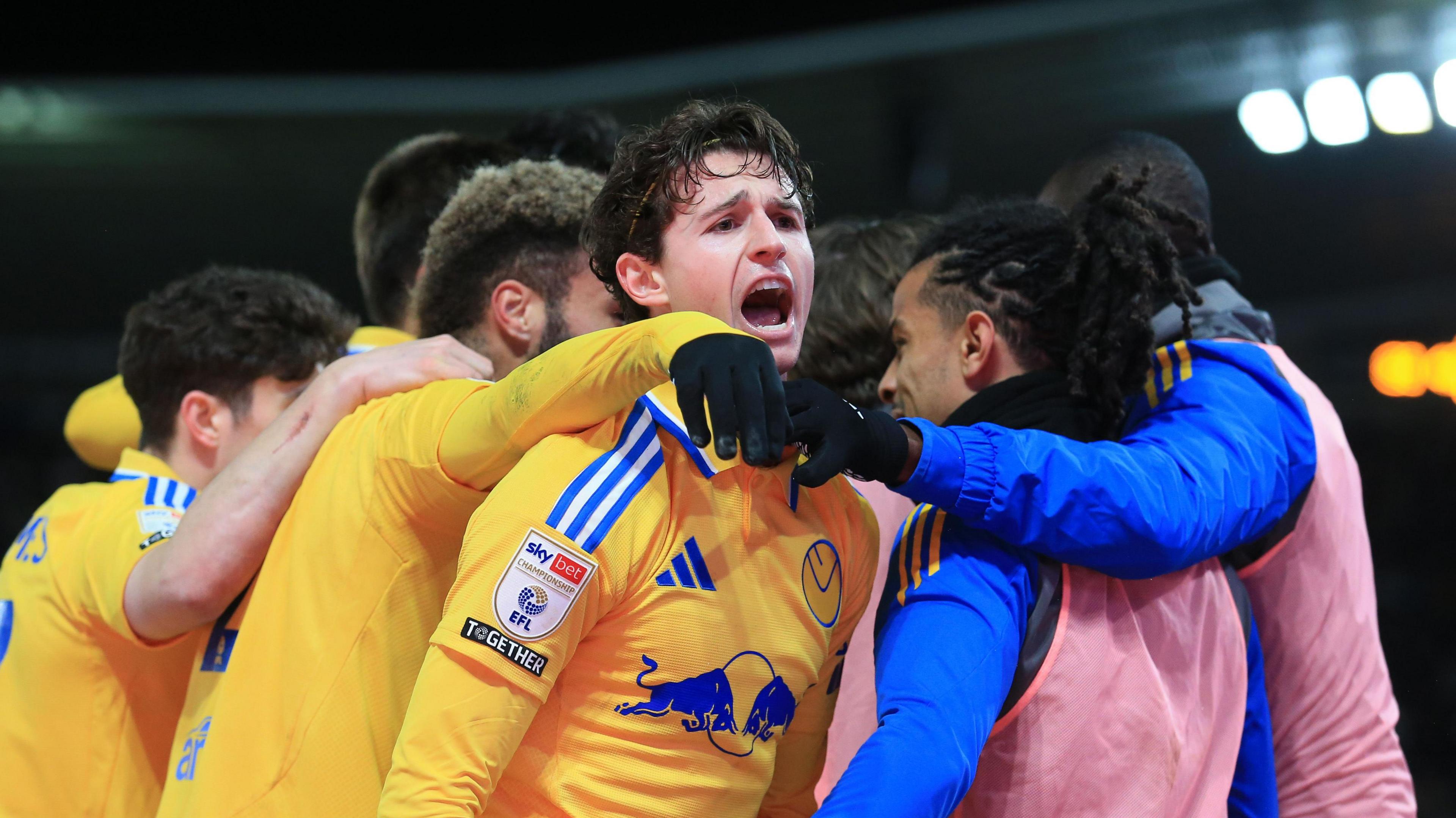 Brenden Aaronson celebrates his goal against Derby with Leeds team-mates