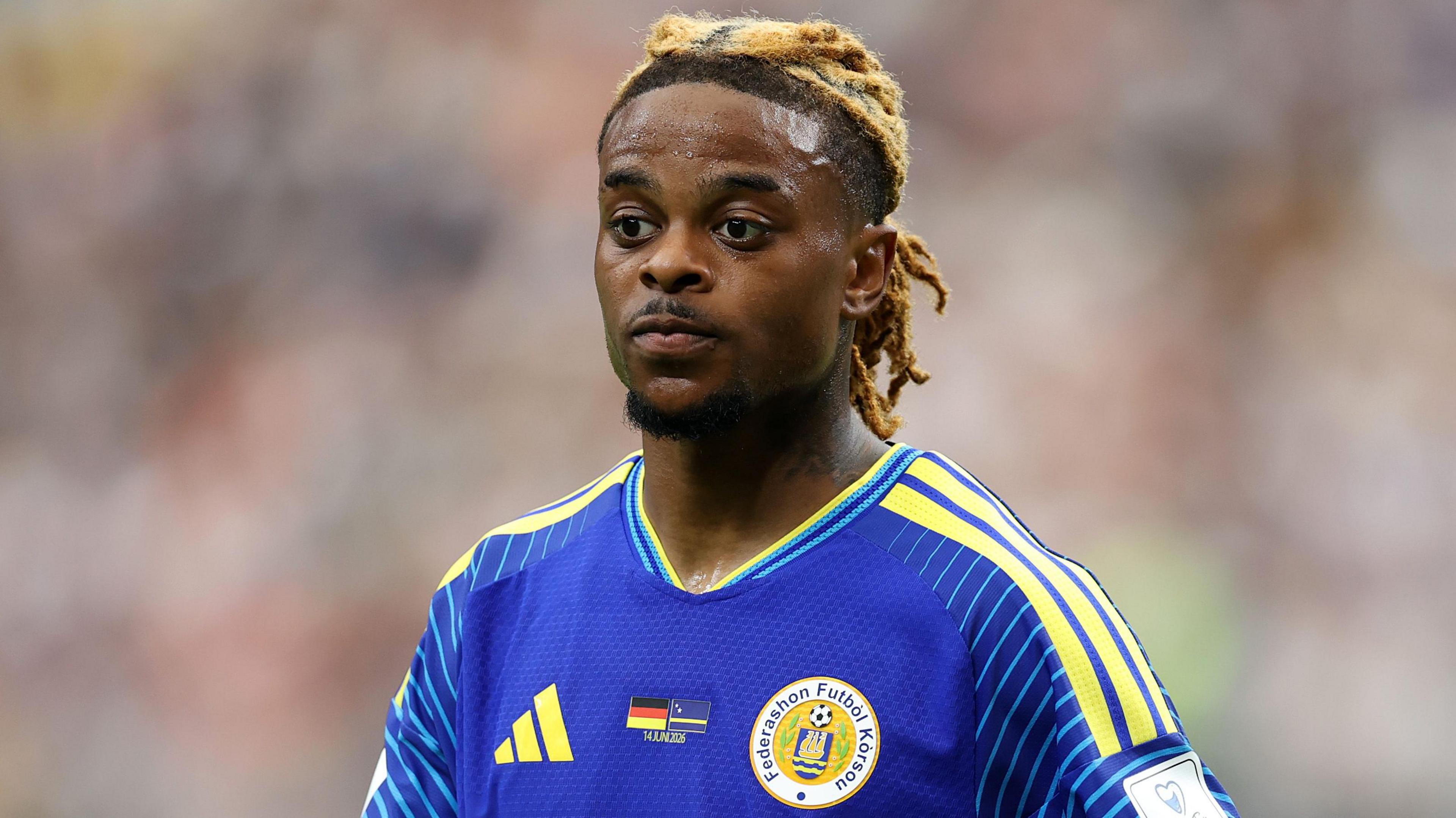 Sontje Hansen wearing Curacao's blue and yellow home jersey during a game at the 2026 World Cup