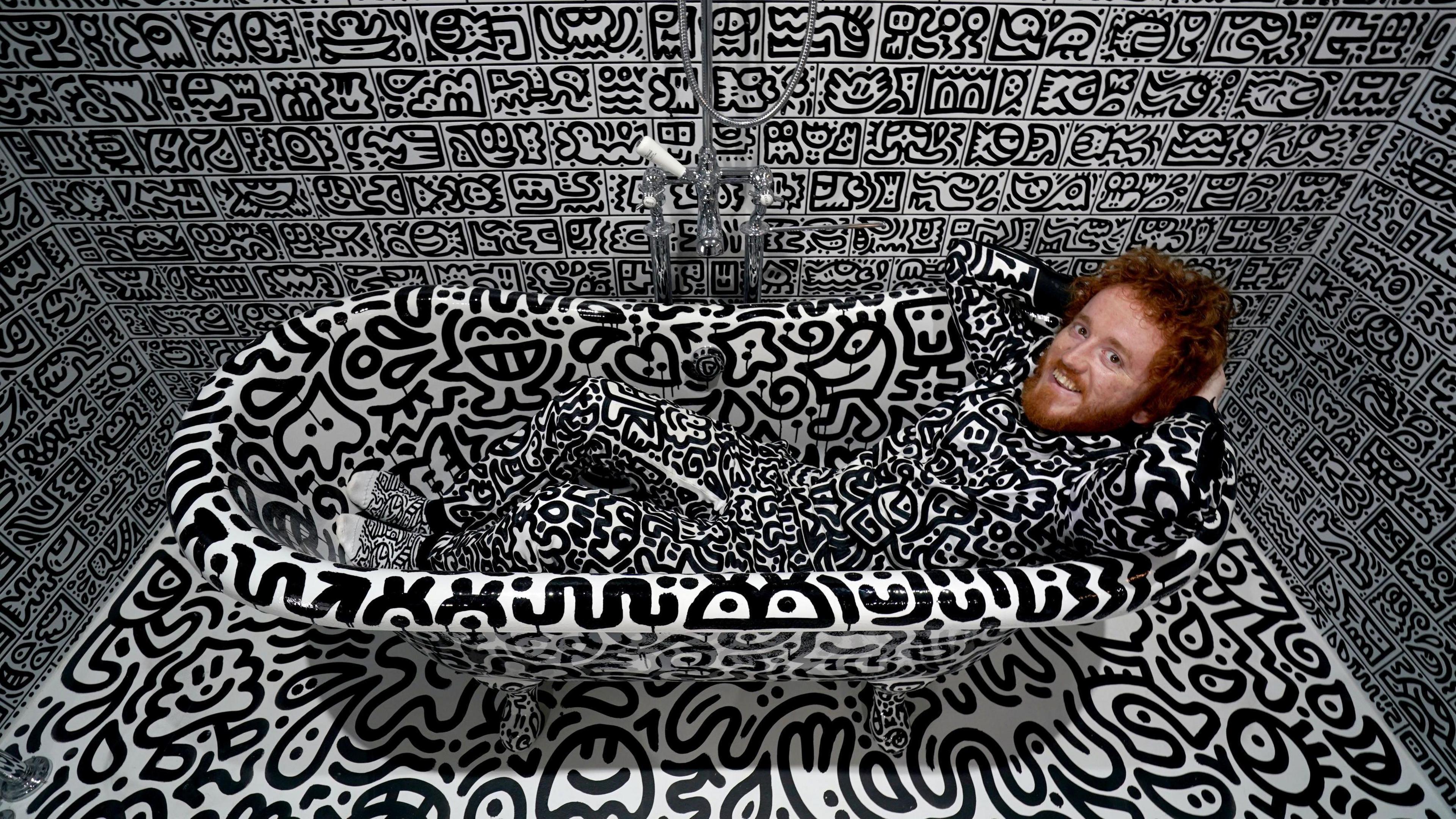 British artist Sam Cox, aka Mr Doodle, reveals the Doodle House, a twelve-room mansion at Tenterden, in Kent, which has been covered, inside and out in the artist's trademark monochrome, cartoonish hand-drawn doodles.