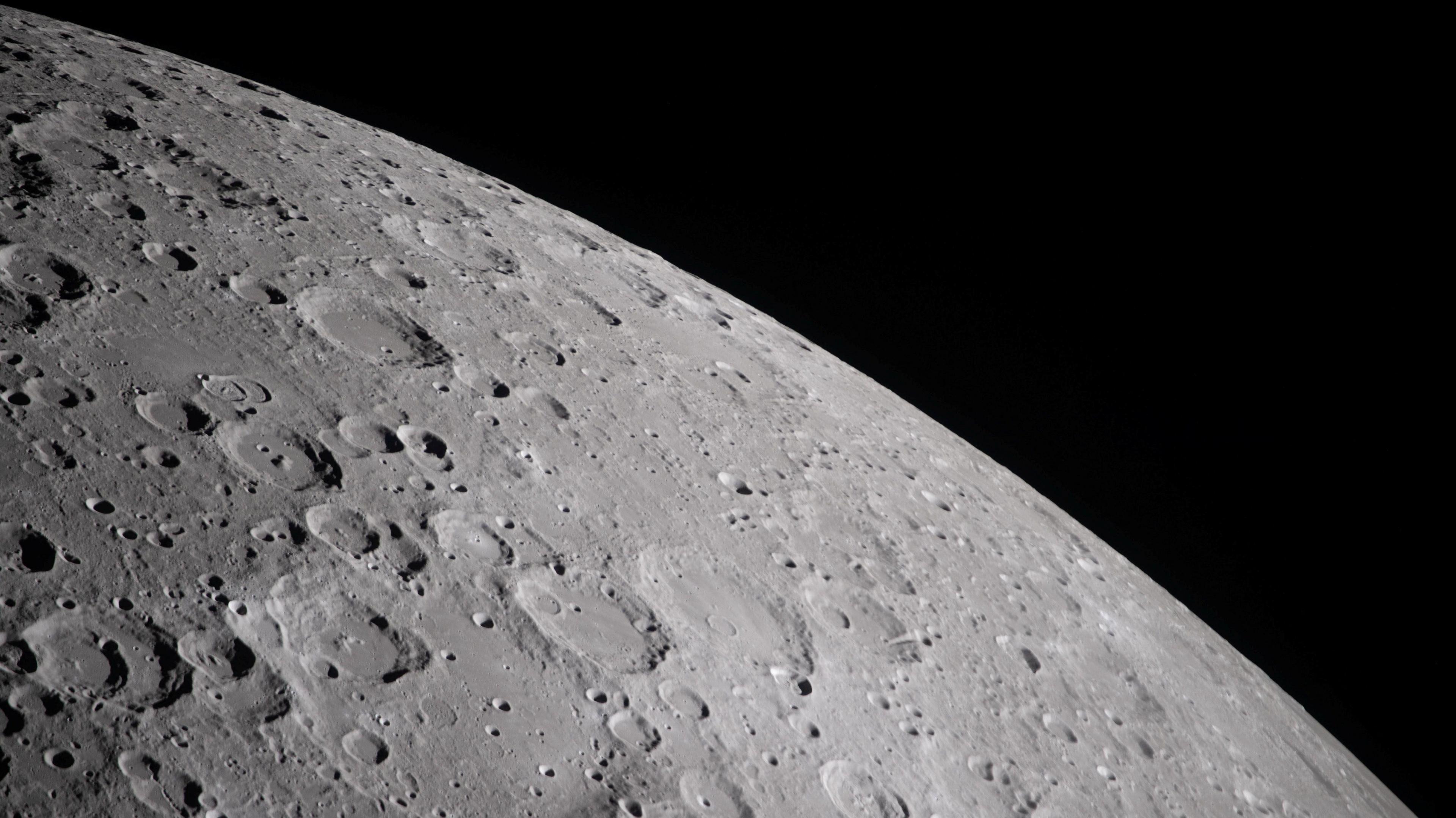A cratered section of the moon is seen close-up