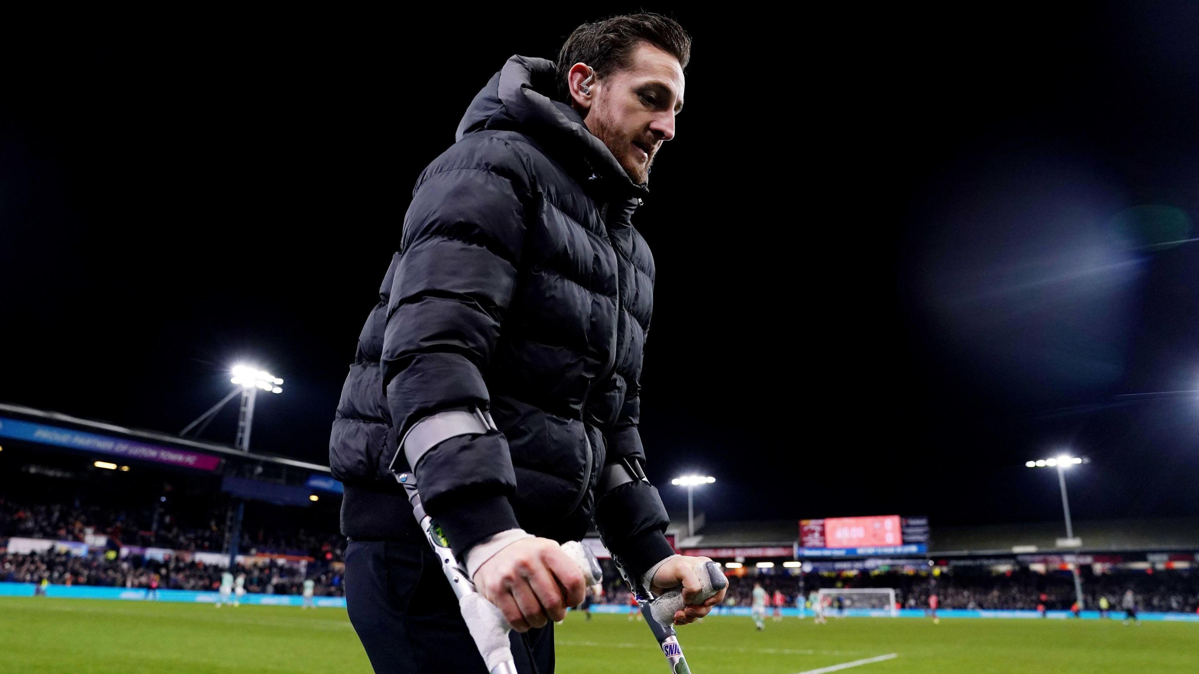 Luton Town defender Tom Lockyer on crutches at Kenilworth Road