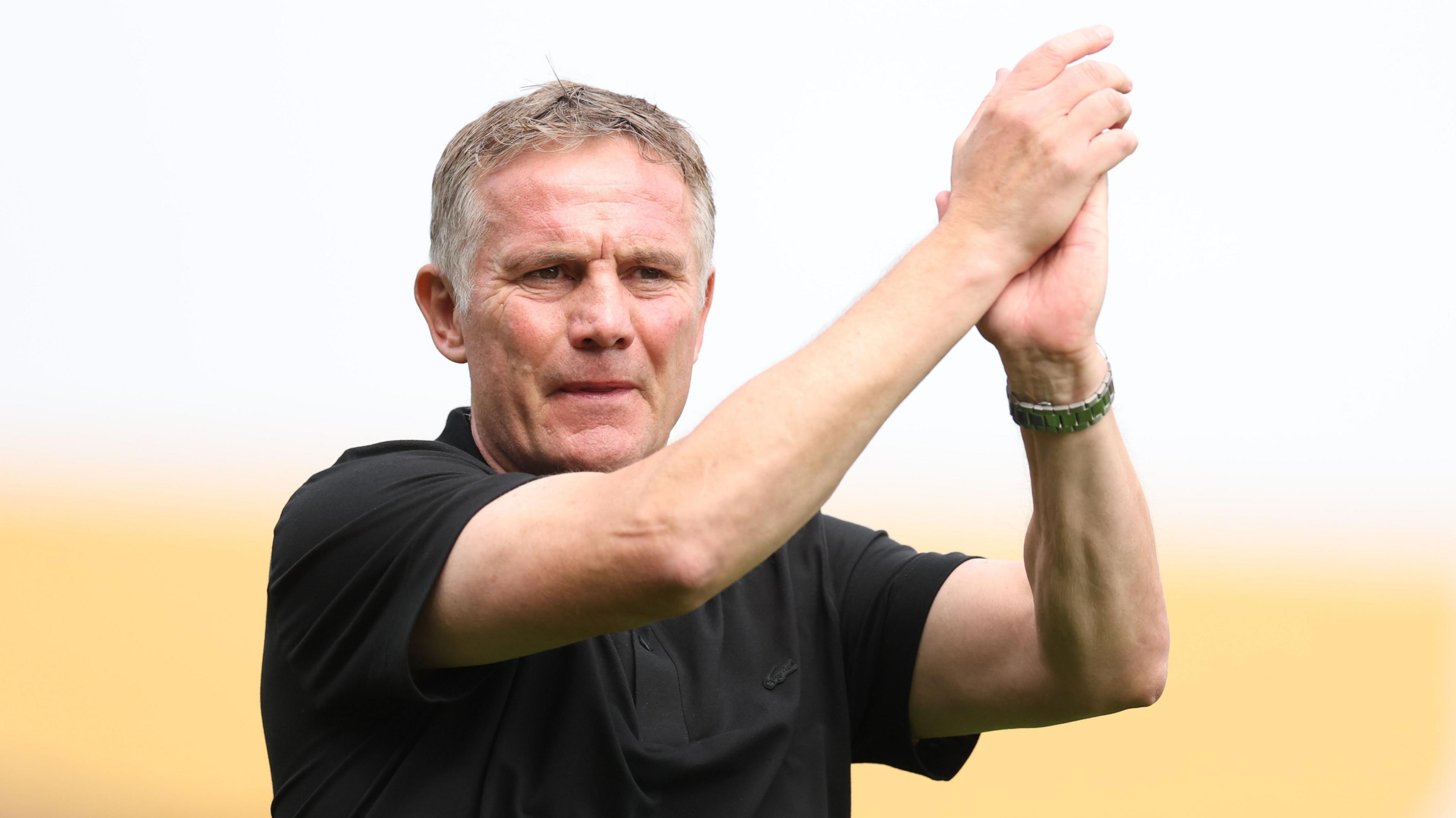 Wrexham manager Phil Parkinson applauds