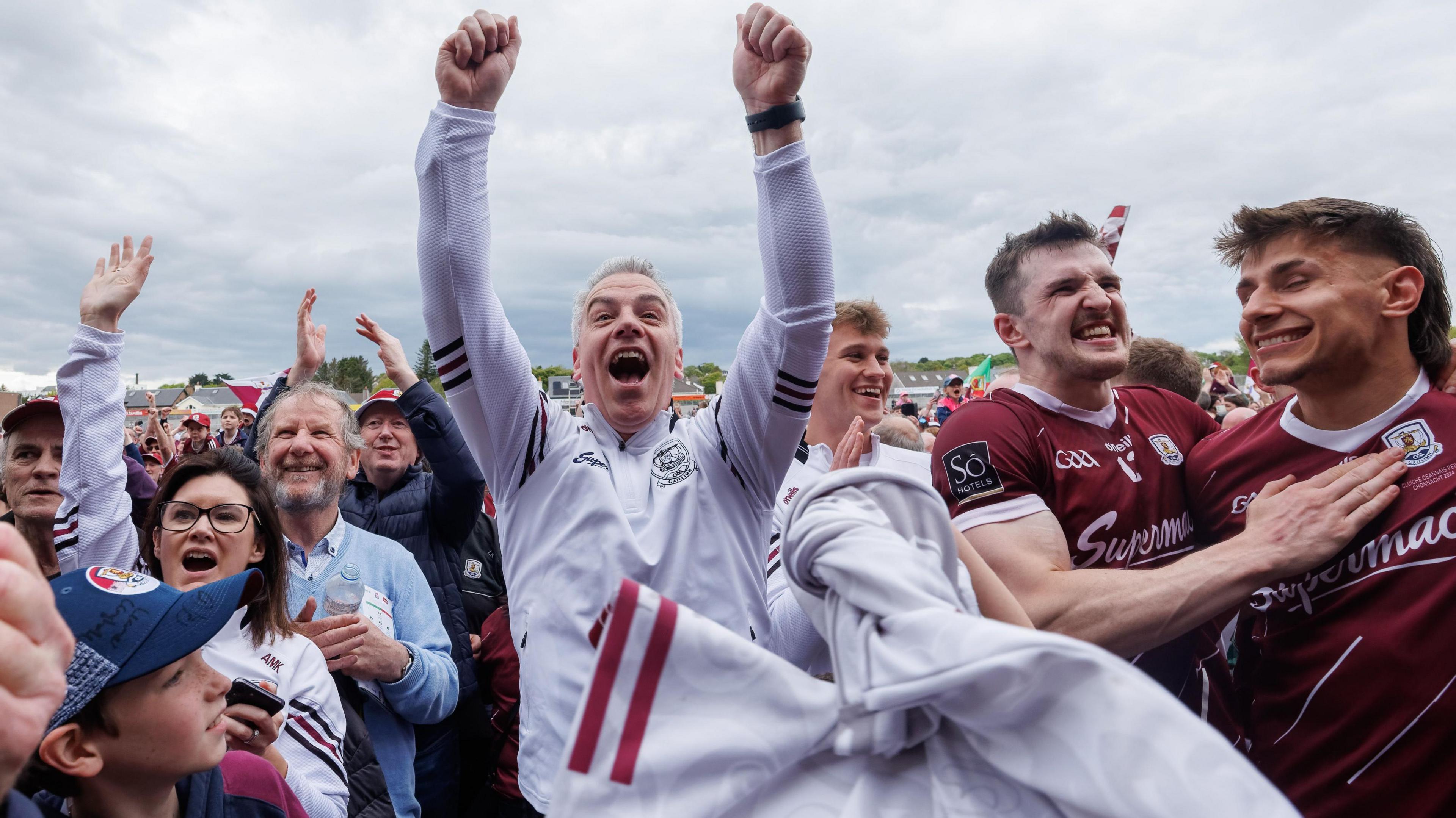 Galway manager Padraic Joyce celebrates with players and fans after his side's Connacht Final triumph