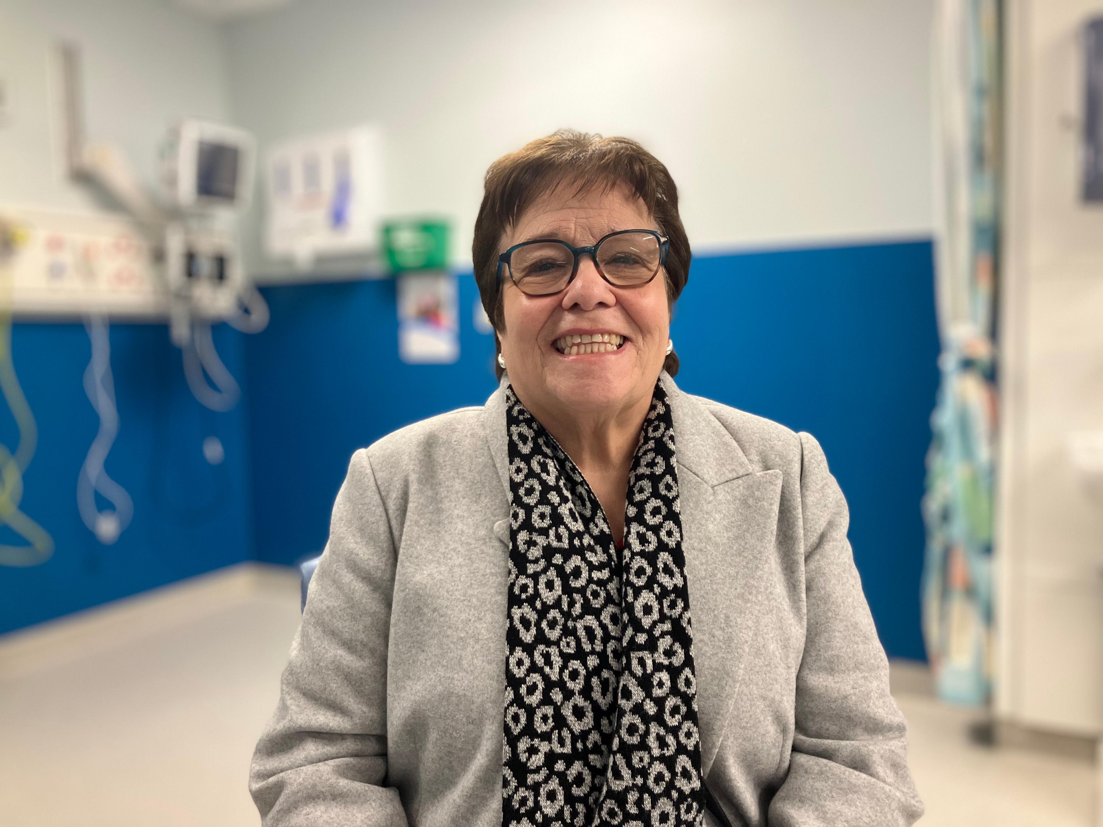 Angela Bradbury sits down and looks into the camera in the refurbished IR department at the QMC