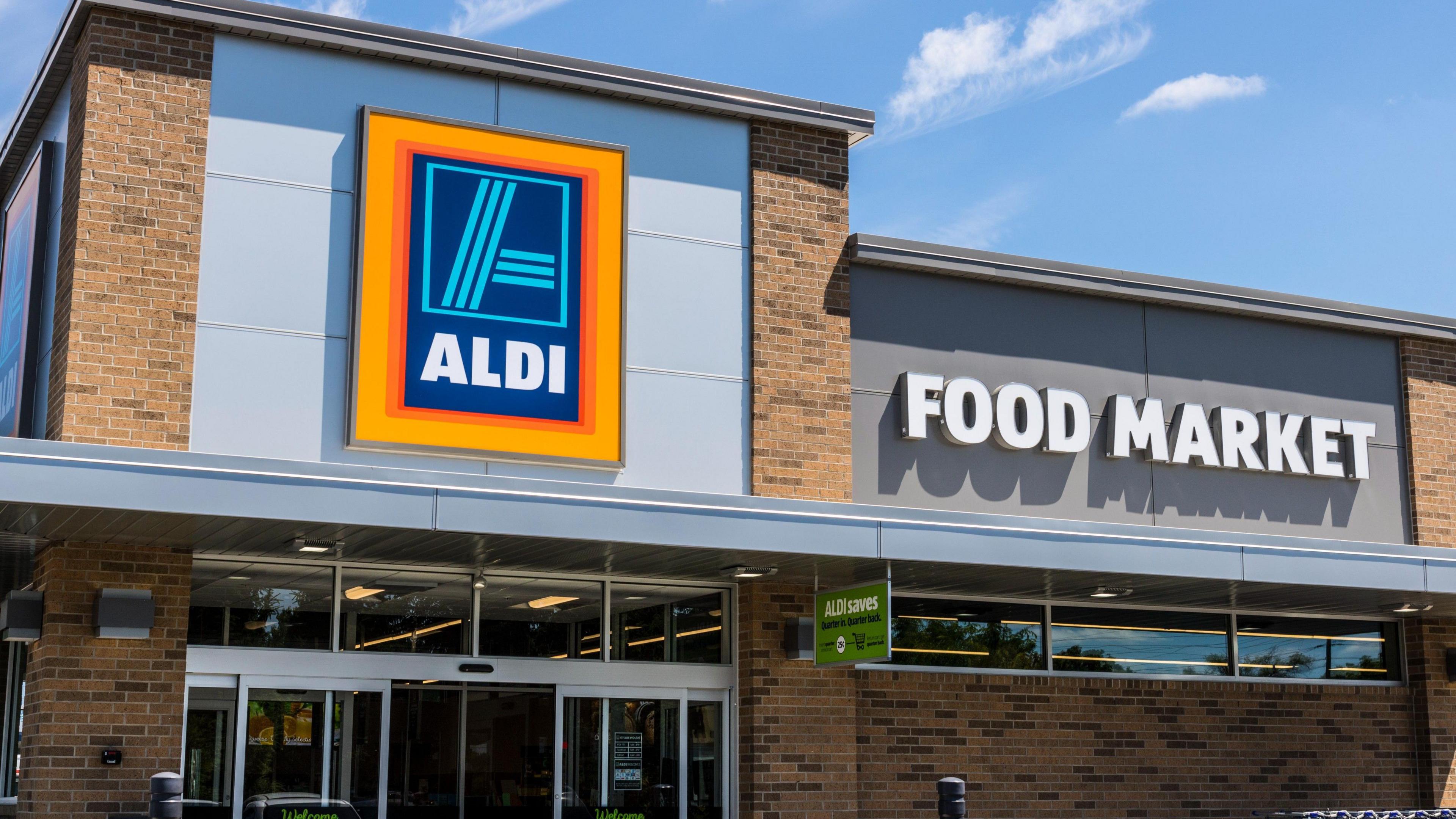 The outside of an Aldi store, with a sign saying 'Food Market'.