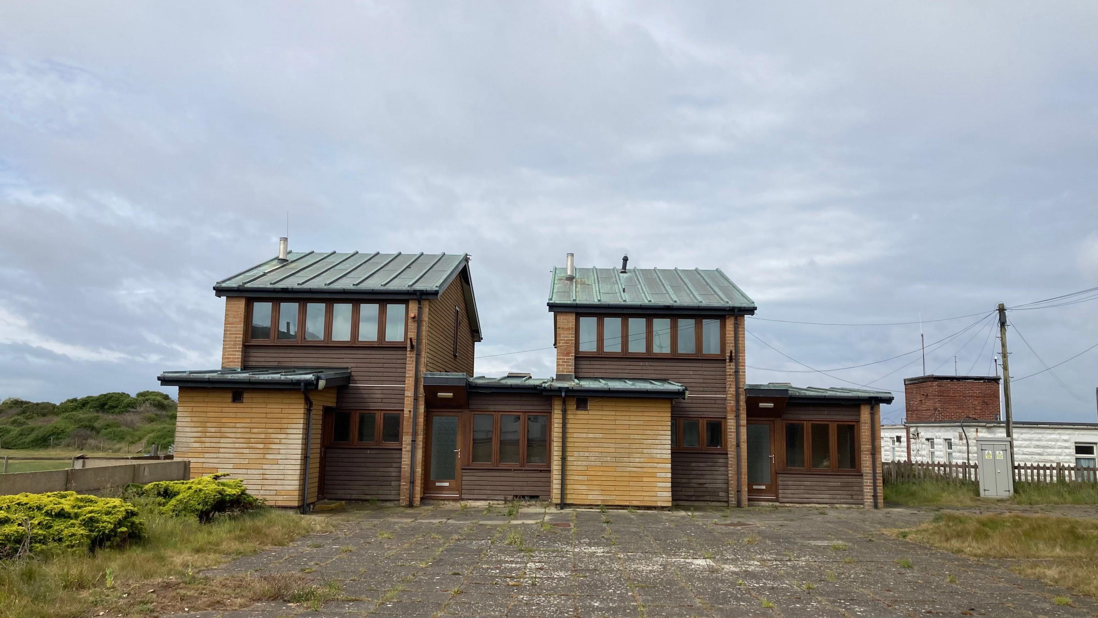 Two two-storey houses side by side. 