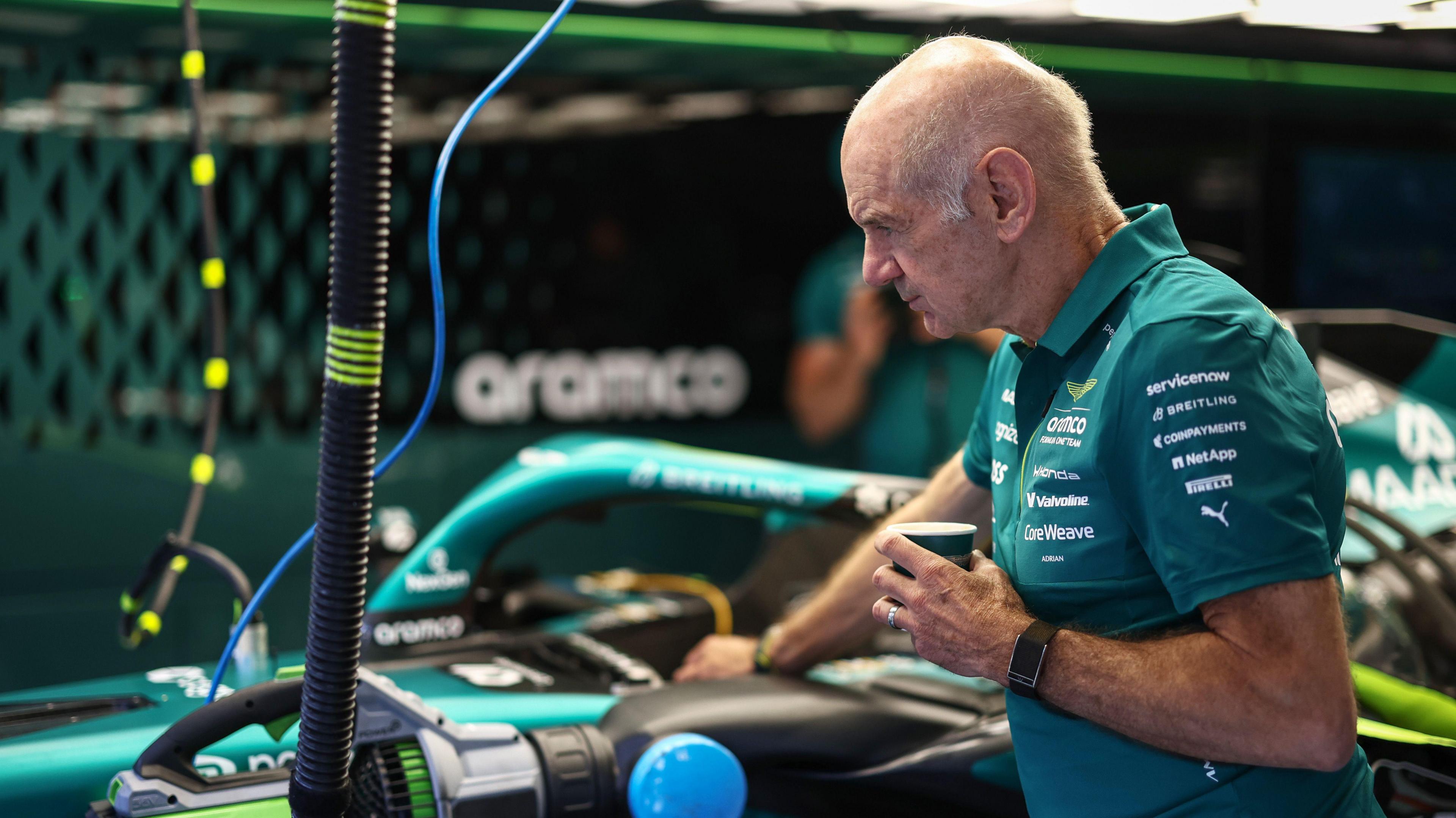Adrian Newey inspects the Aston Martin in the team garage at the 2026 Hungarian Grand Prix