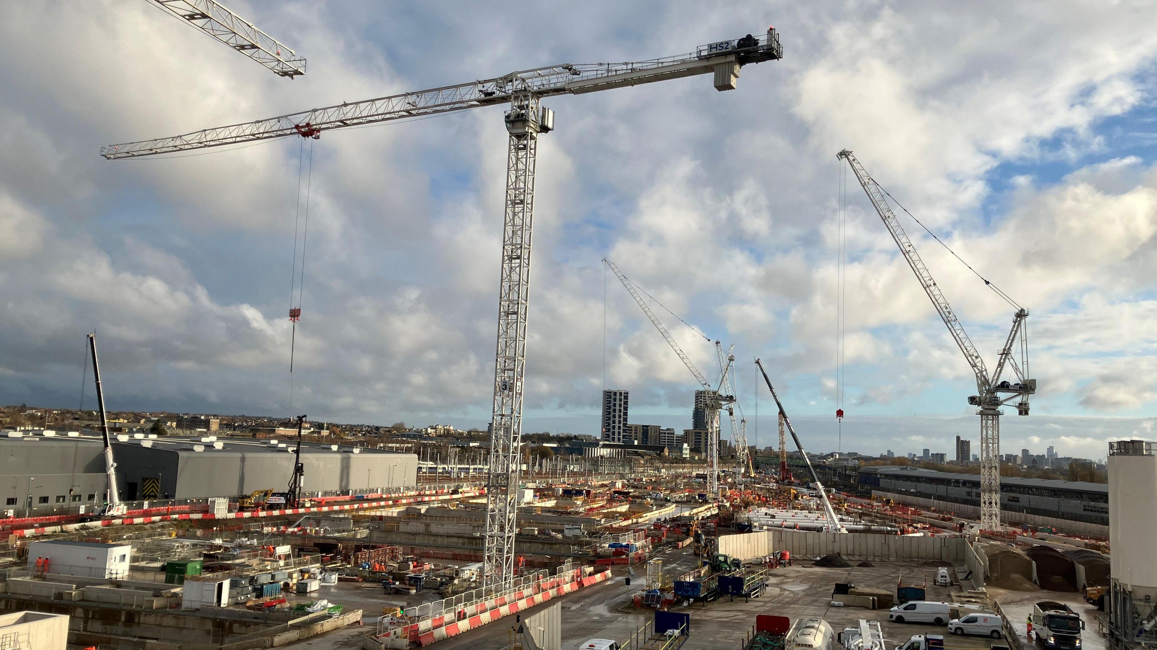 A shot of the skyline over Old Oak Common showing the construction site with cranes hanging over the area