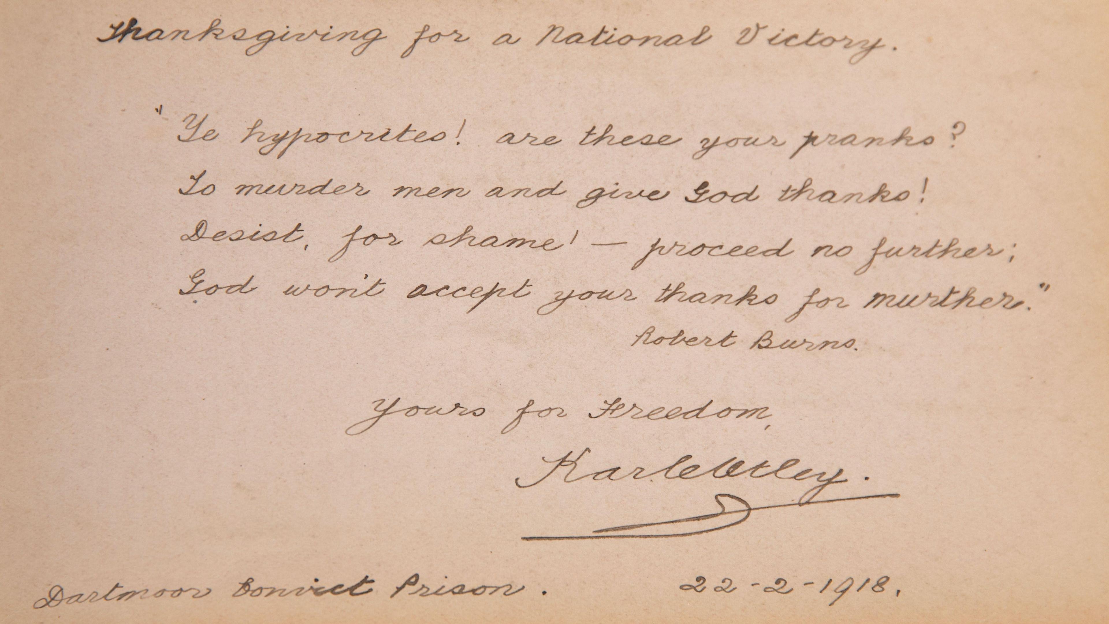 A picture of a brown page with handwritten writing on it. It has many words on it and a number of lines.