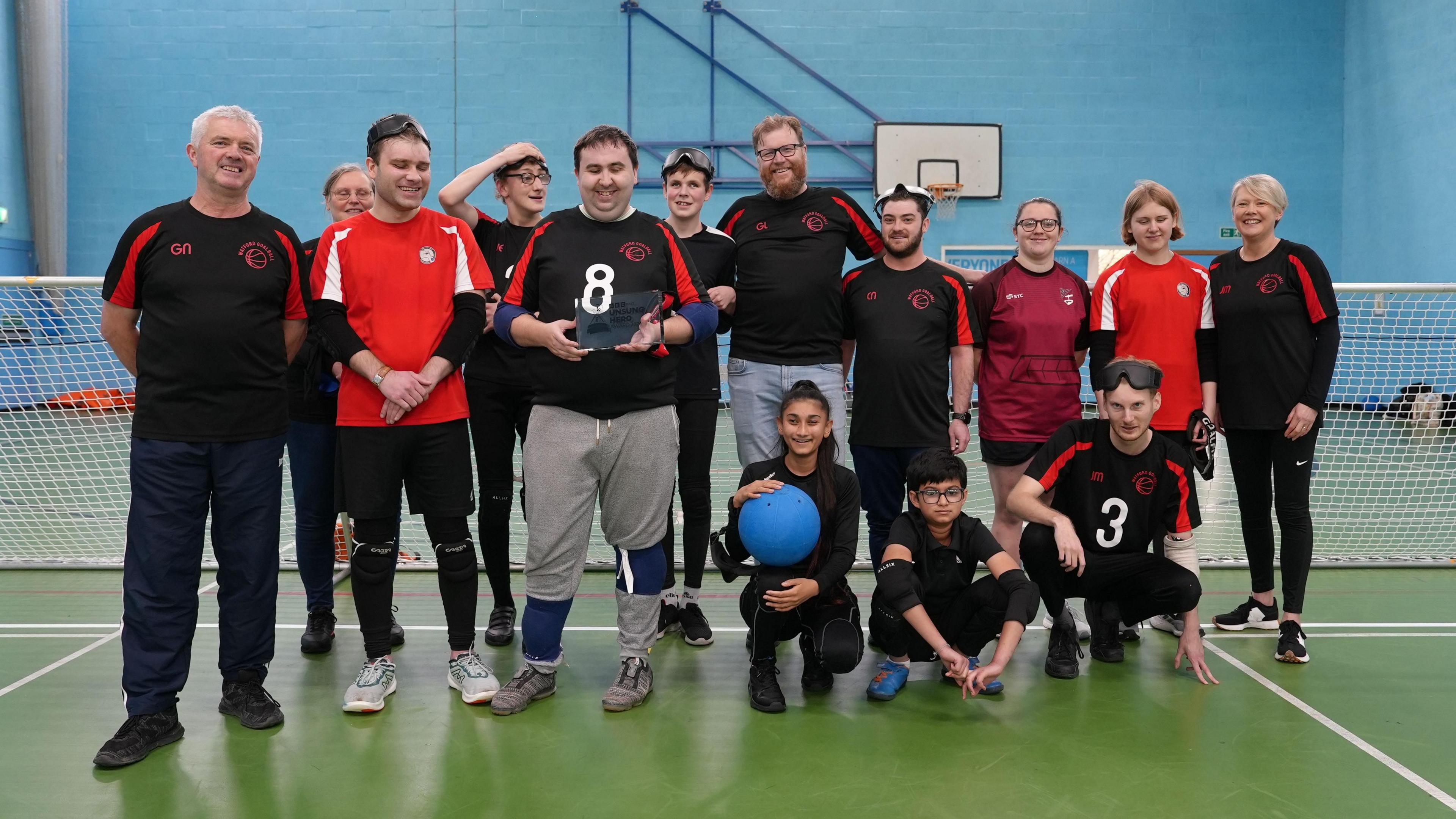 George Sullivan with his trophy, and members of the Watford goalball team.