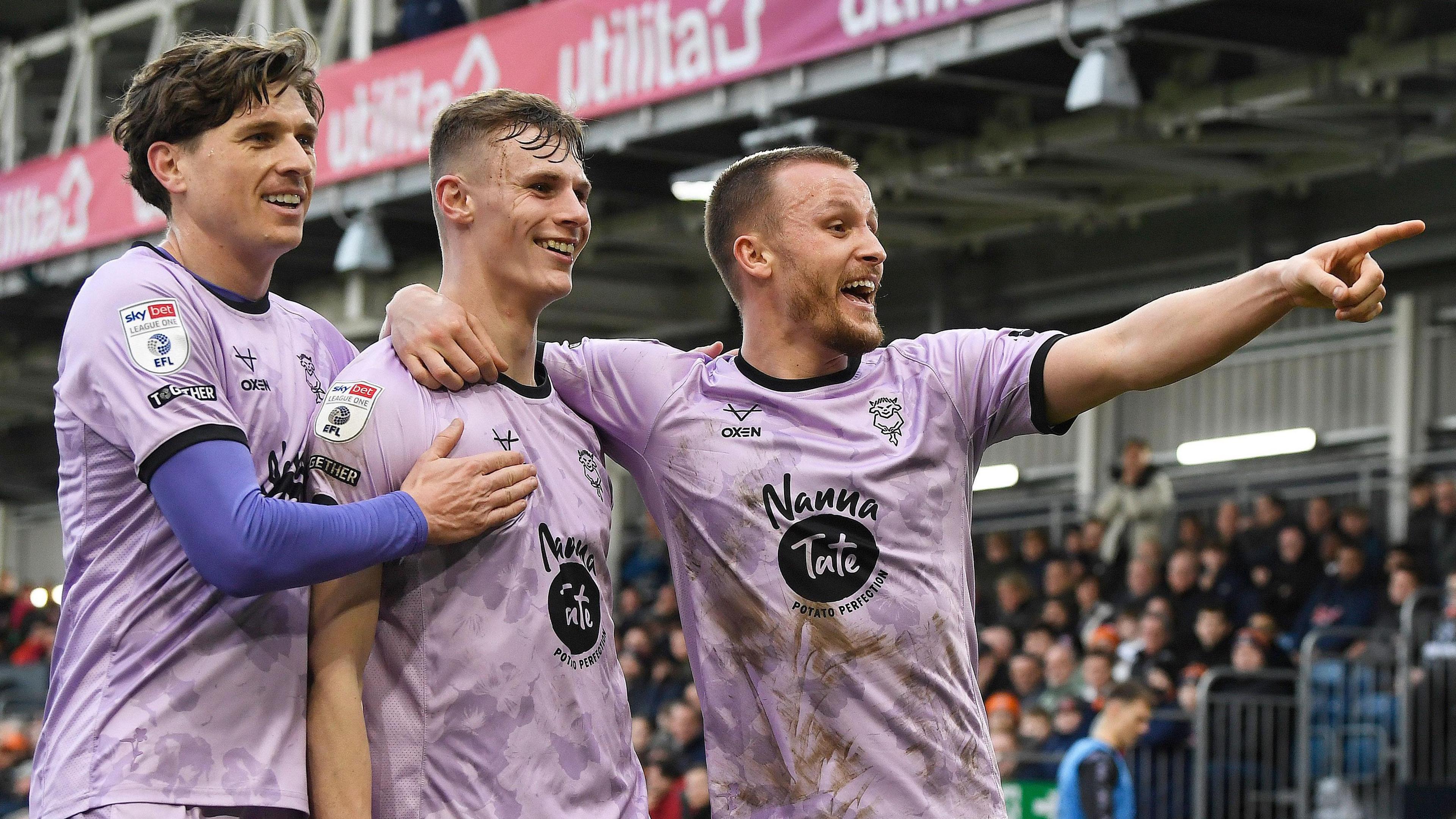 Rob Street celebrates after scoring for Lincoln