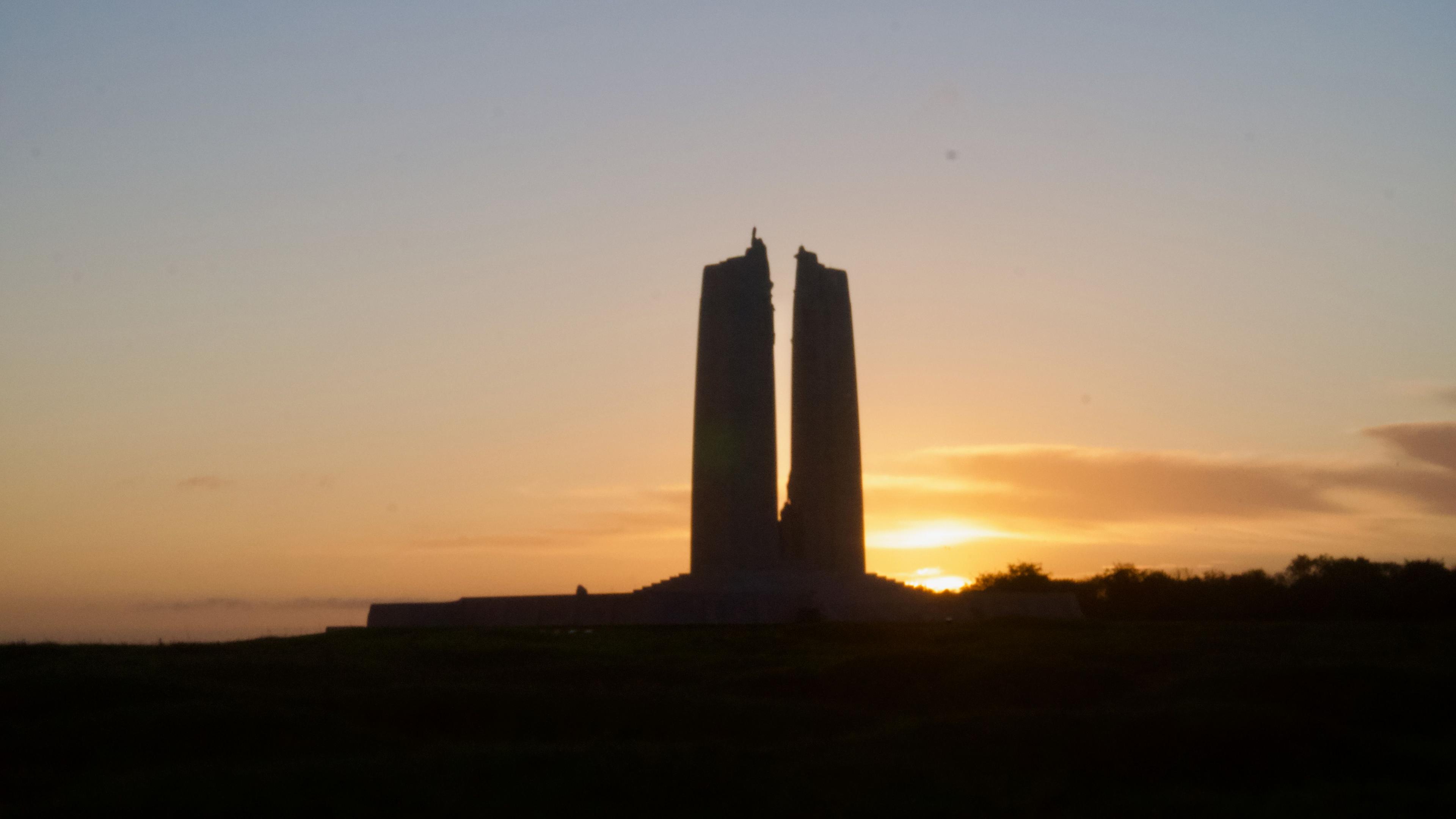 War memorial with sunrise behind