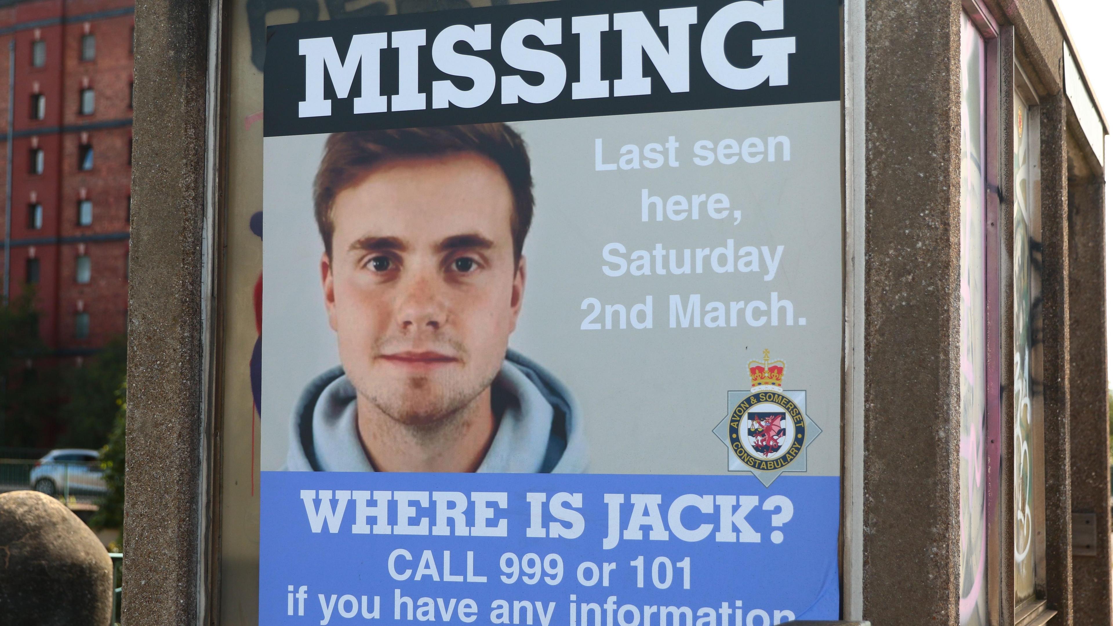 A missing person poster in Bristol of Jack O'Sullivan. The word "missing" is written at the top in white capital letters, above a picture of him. He has short fair hair and stubble. He is looking directly at the camera and smiling. Next to the picture of Jack is some white text reading "last seen here, Saturday 2nd March". The bottom of the poster reads: "Where is Jack? Call 999 or 101 if you have any information."