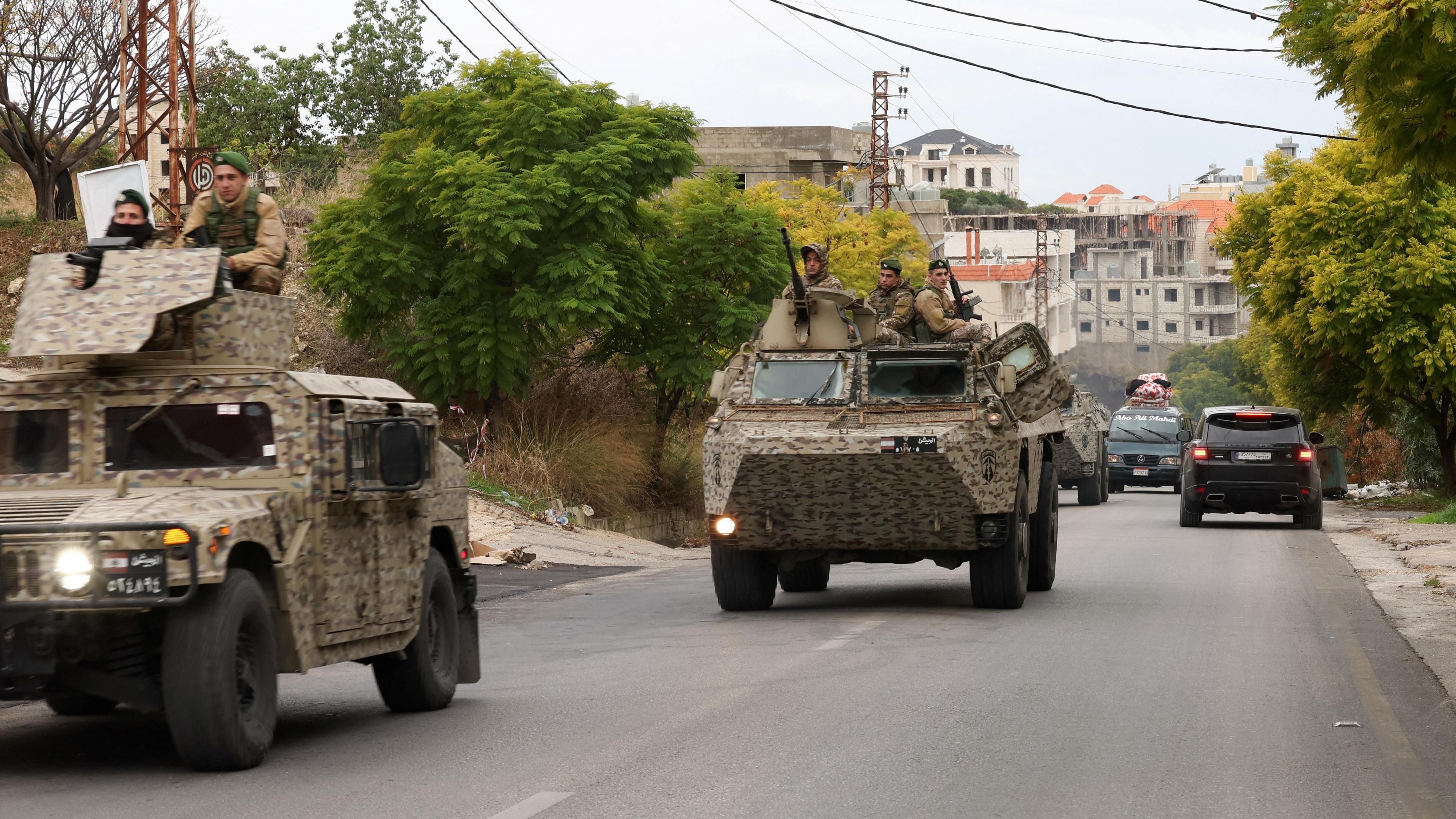 Lebanese army soldiers drive in Qana, southern Lebanon, after the start of the ceasefire (27 November 2024)