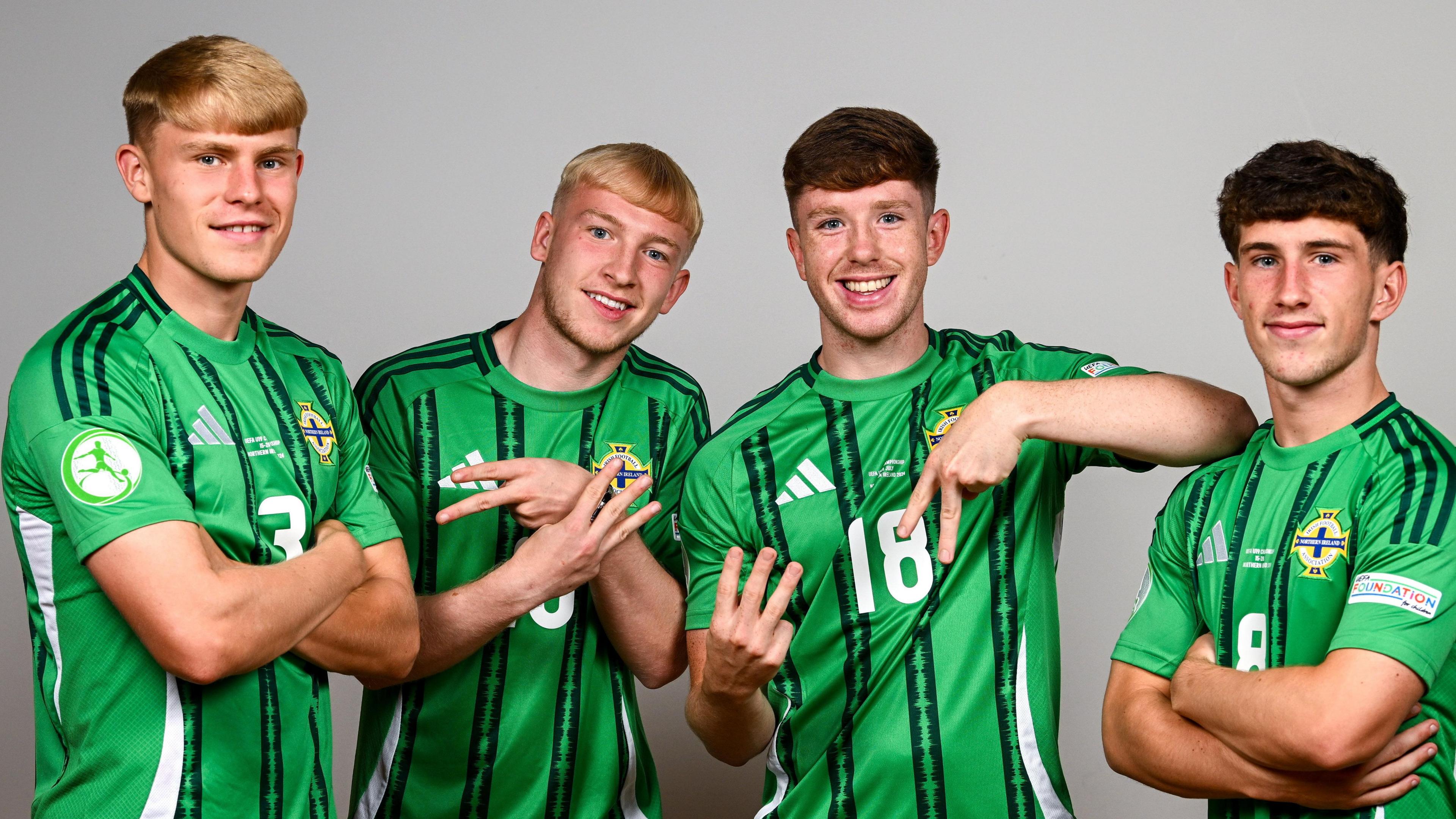 The Uefa European Under-19 NI players in green football tops 