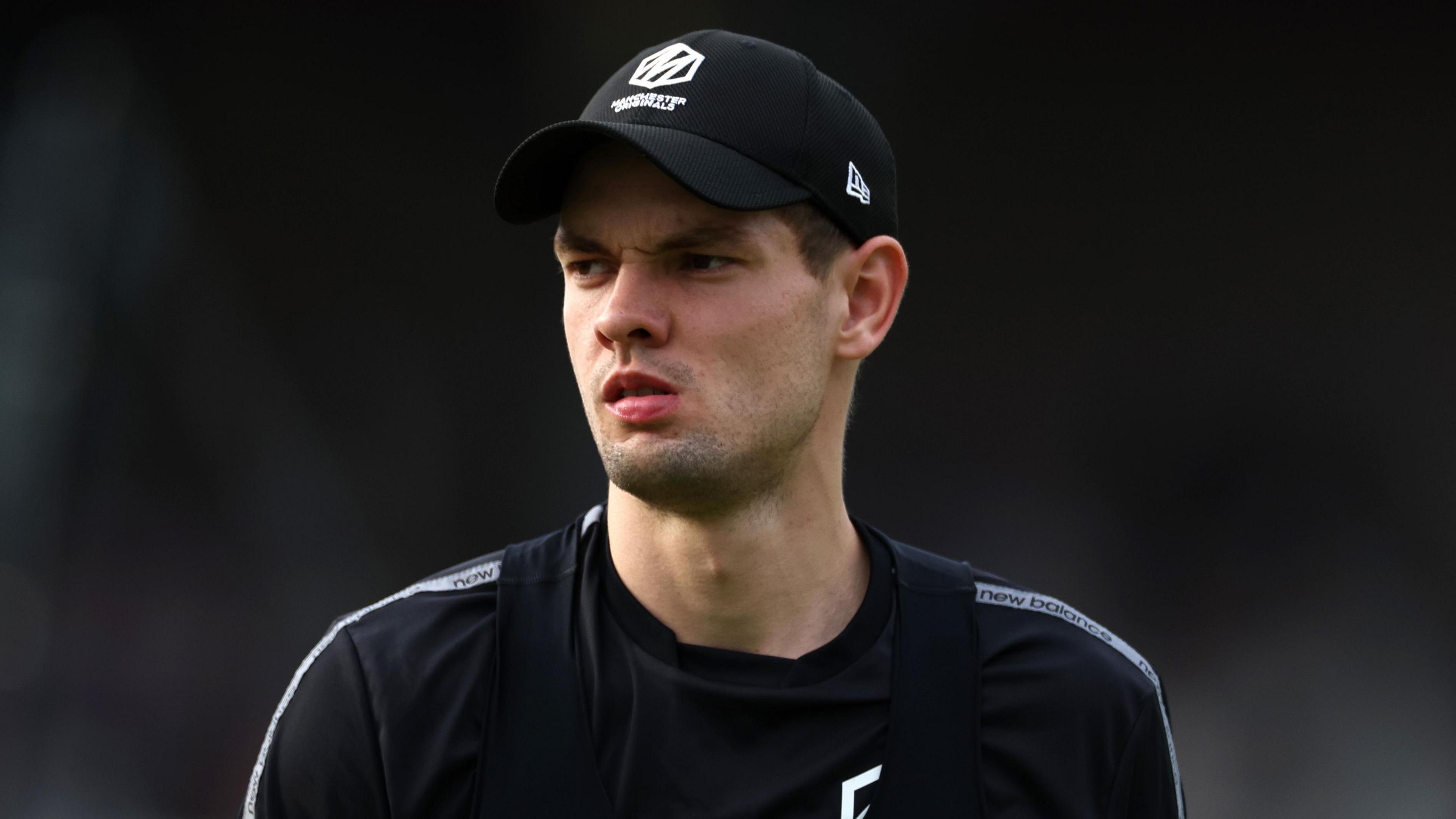 Manchester Originals bowler Scott Currie looks on before a Hundred match