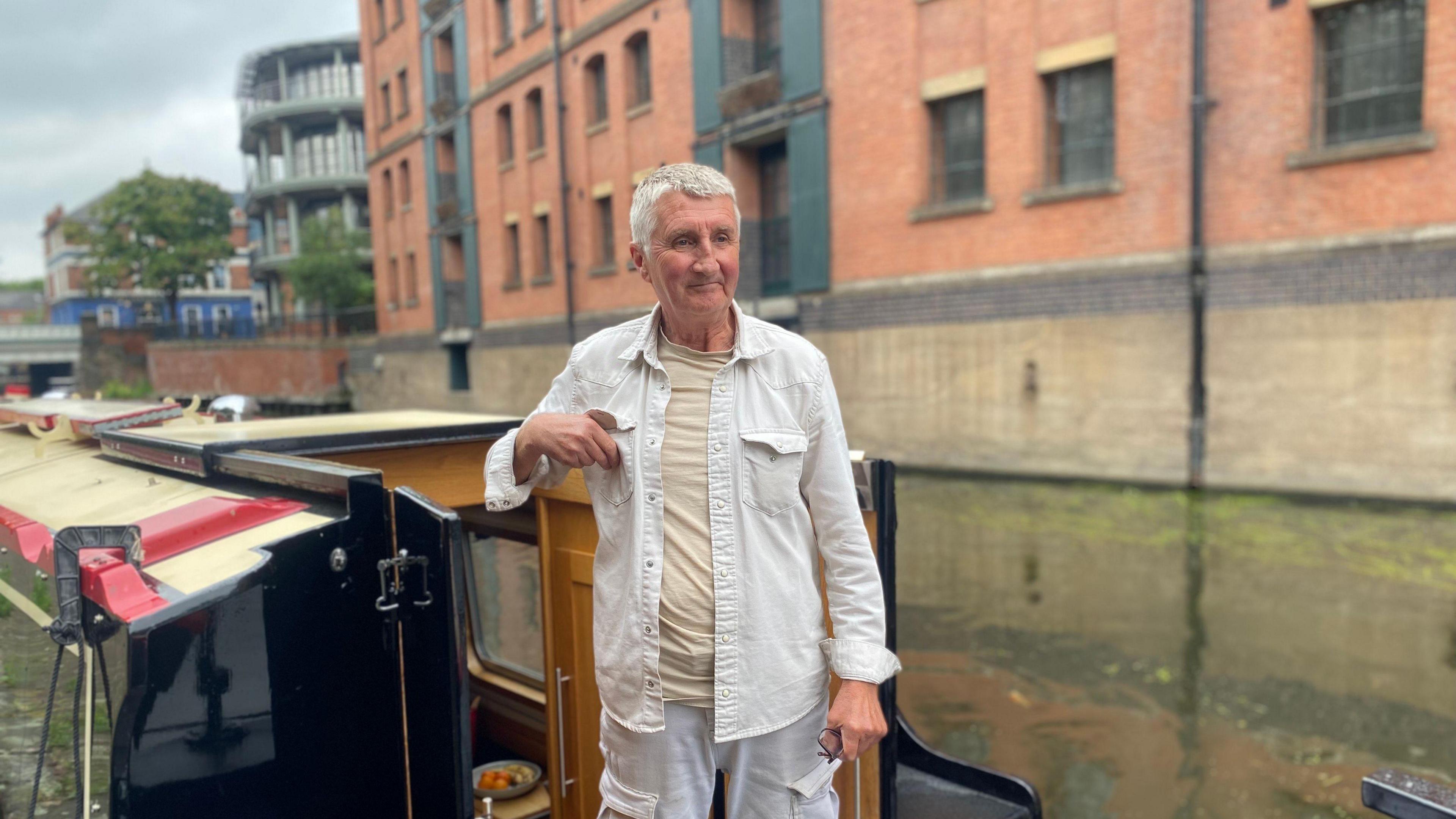 John Ball on the deck of his narrowboat
