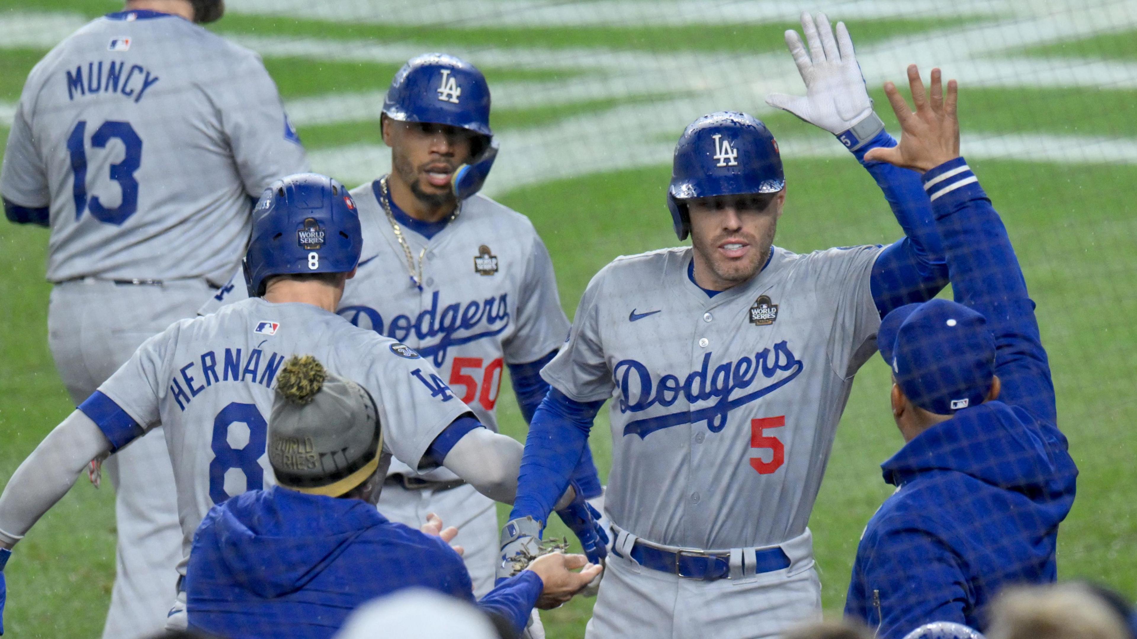 Los Angeles Dodgers first baseman Freddie Freeman (number five) celebrates his first-inning home run