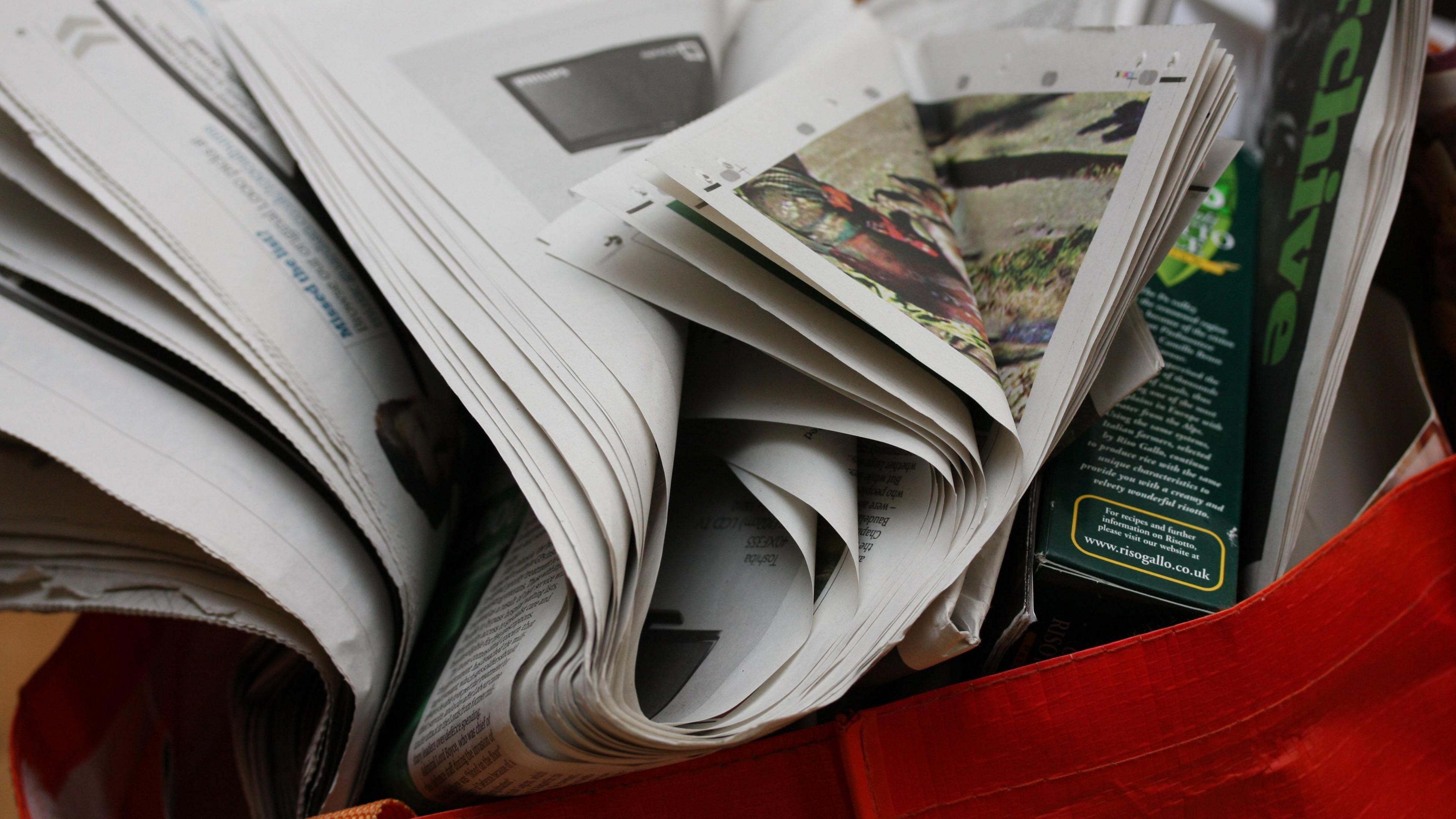 Newspapers in a bag ready to be recycled