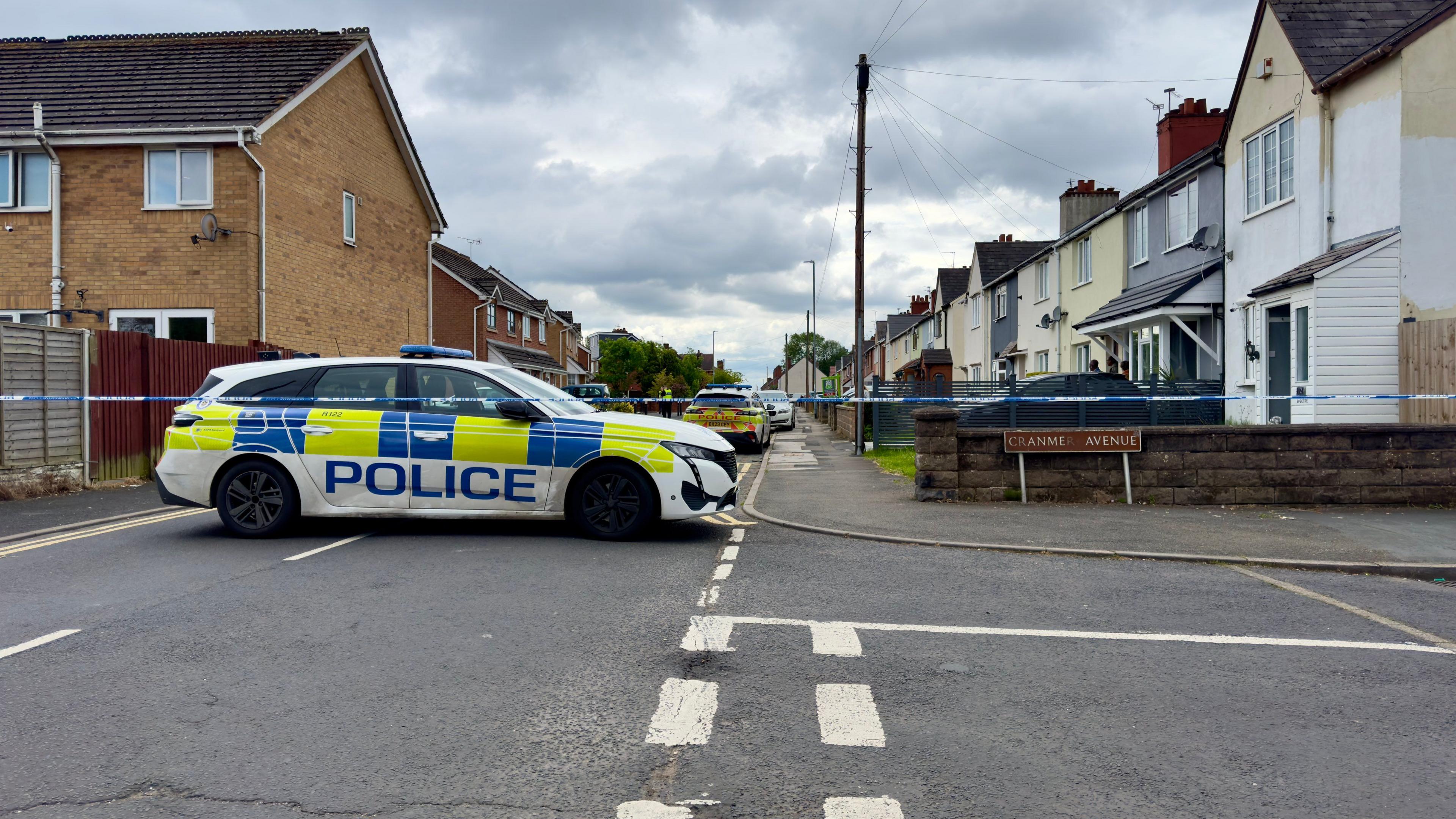 Police at the scene of a stabbing in a residential street