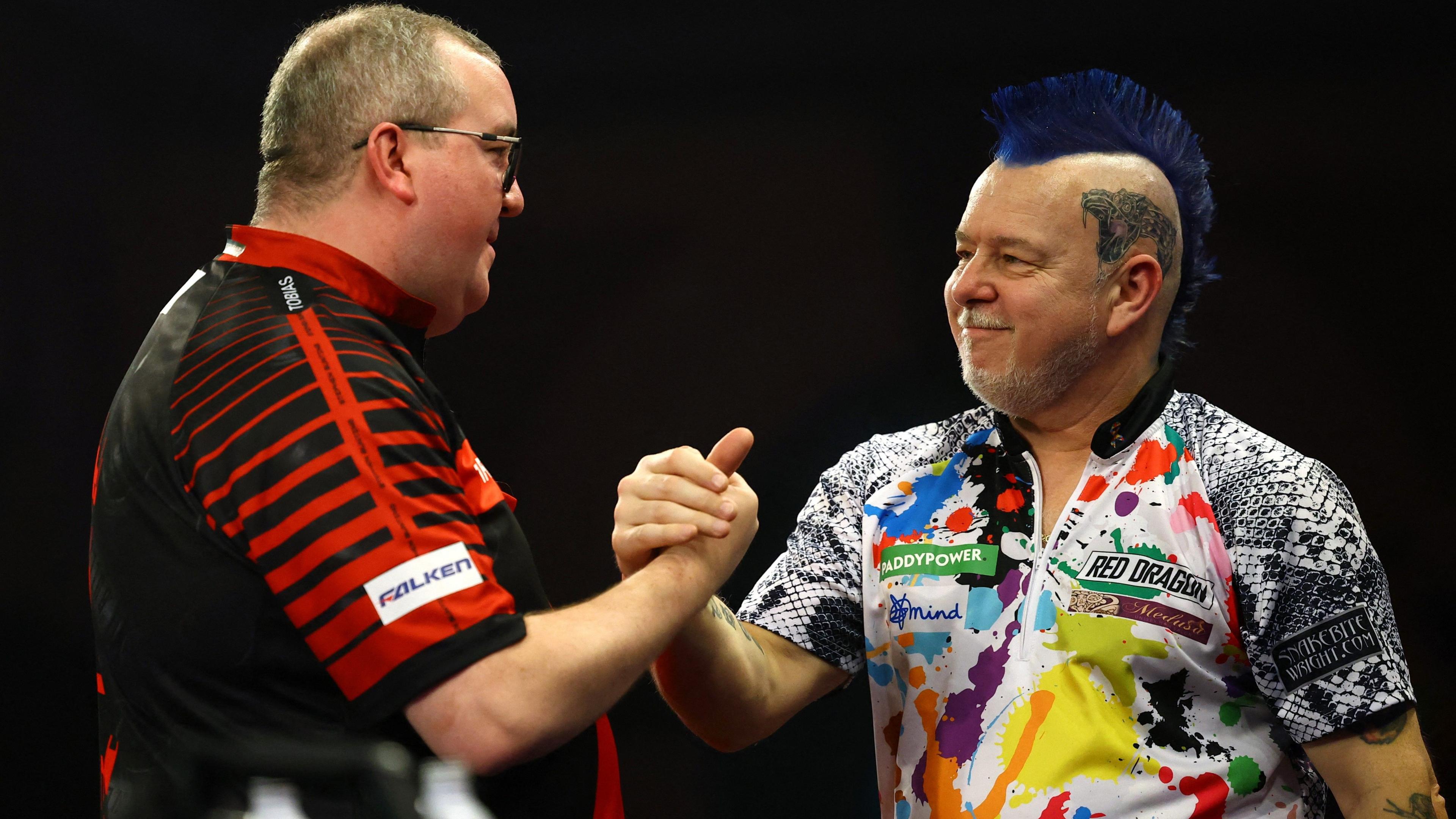 Stephen Bunting is congratulated by Peter Wright