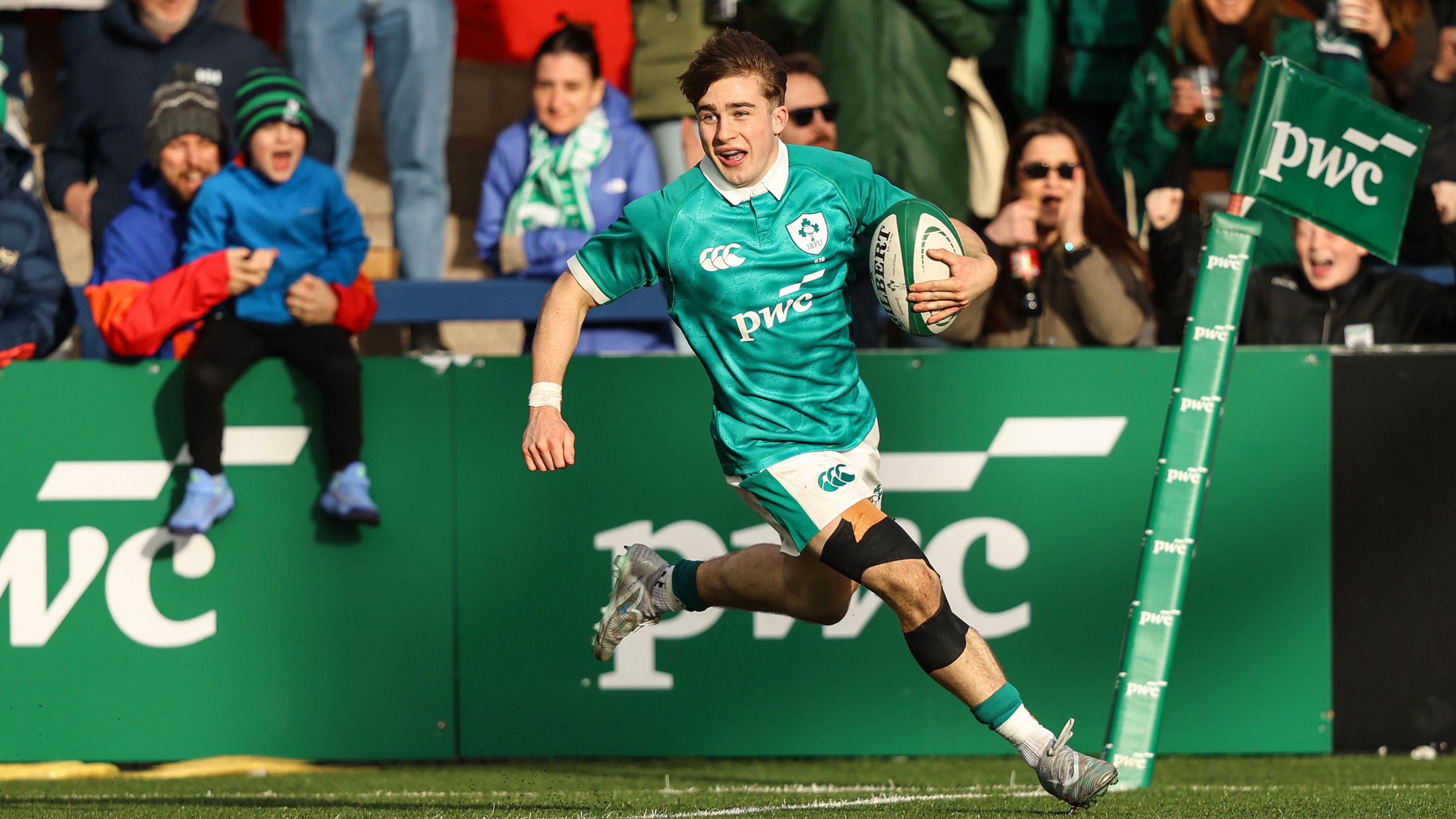 Christopher Barrett runs in his side's sixth try