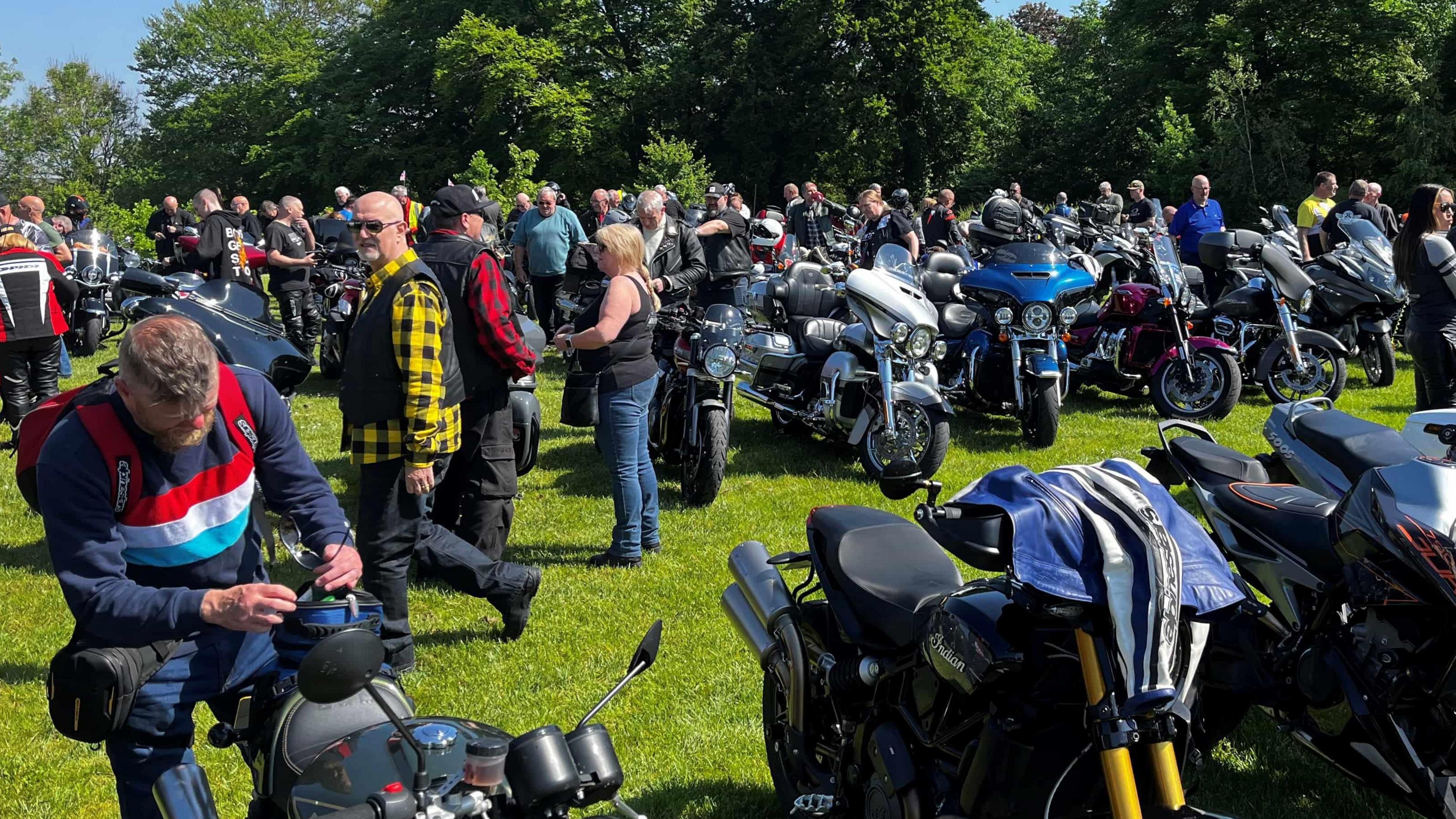 A large group of motorcyclists outside