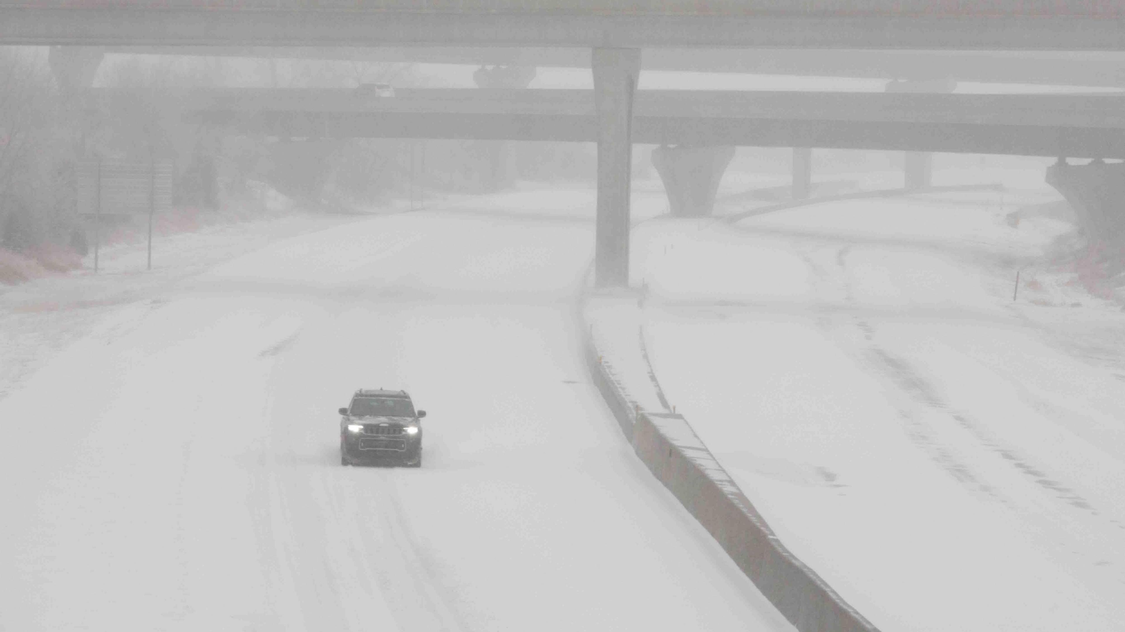 A car driving on snowy roads.