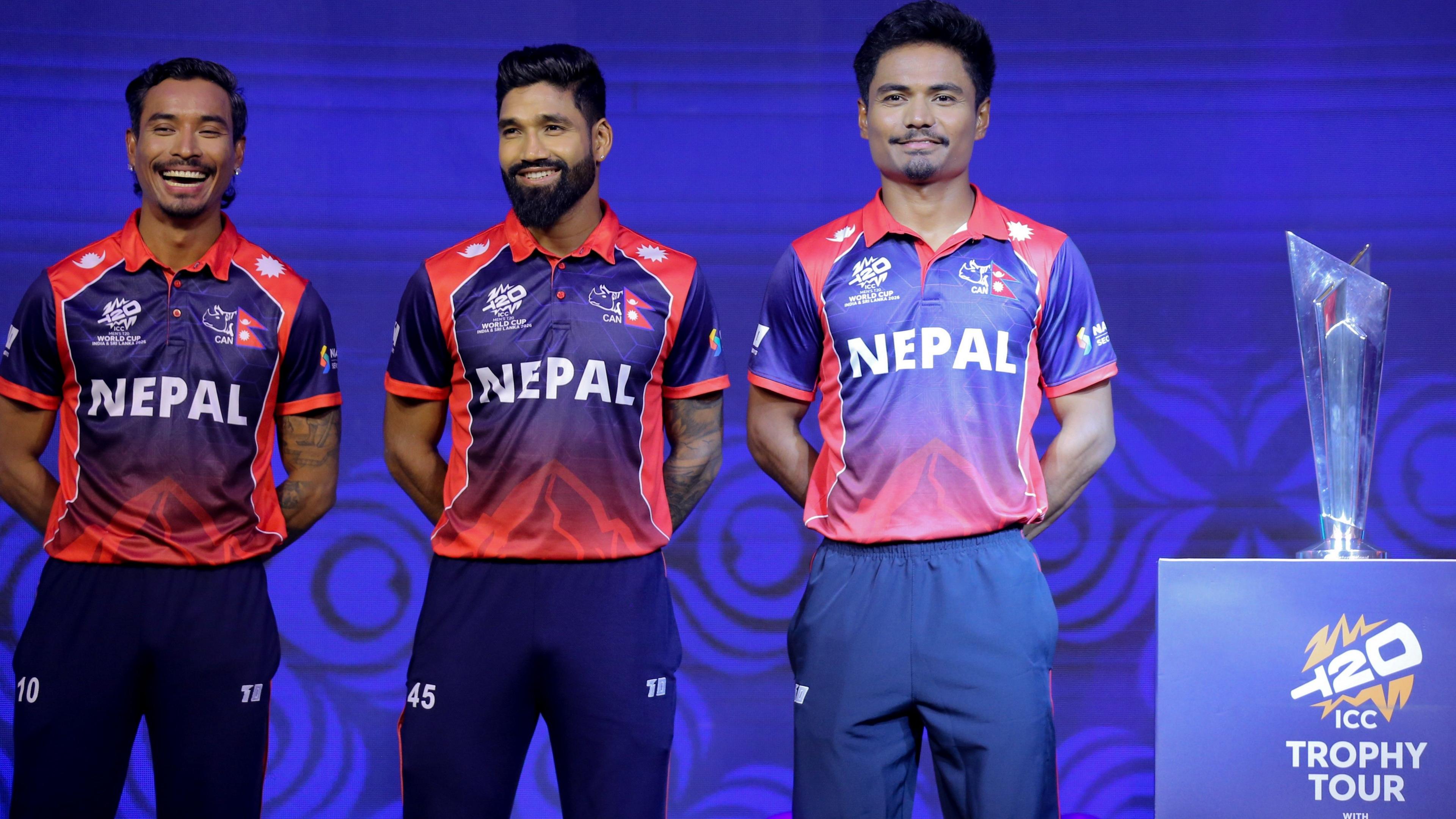 Nepal cricket team players stand beside T20 WC trophy