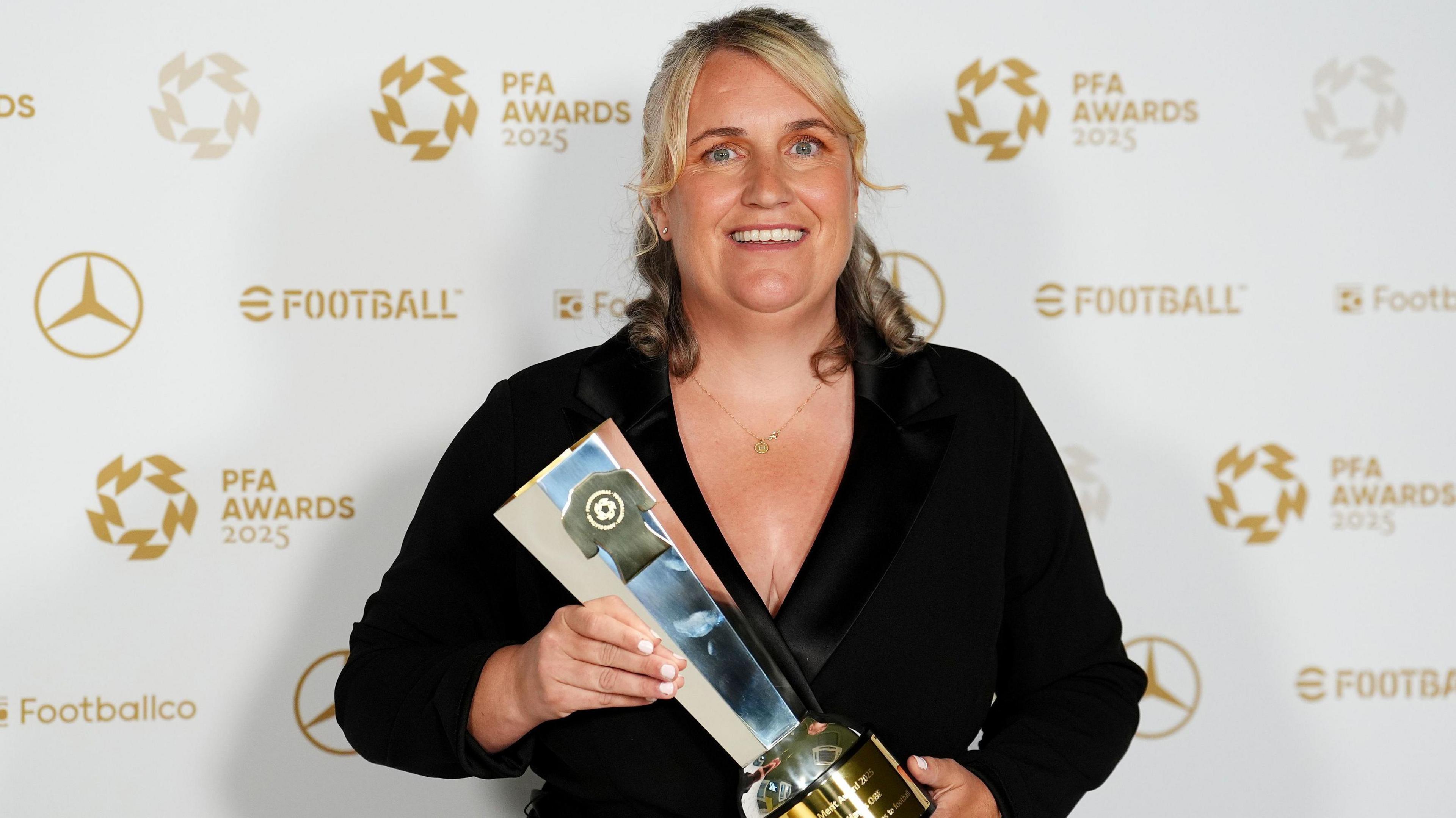 Emma Hayes holding her PFA Merit Award