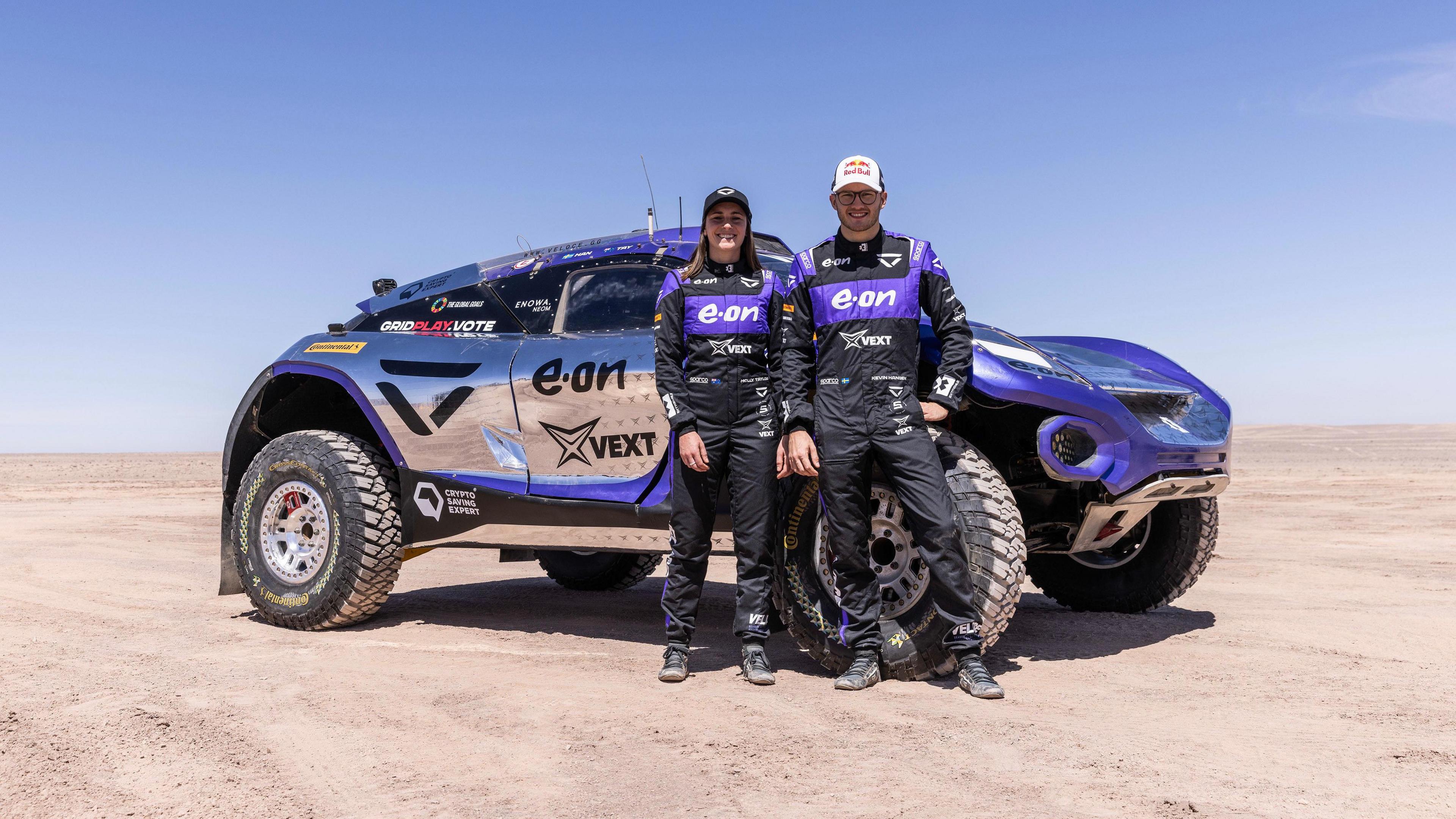 Molly Taylor and Kevin Hansen standing in front of a car