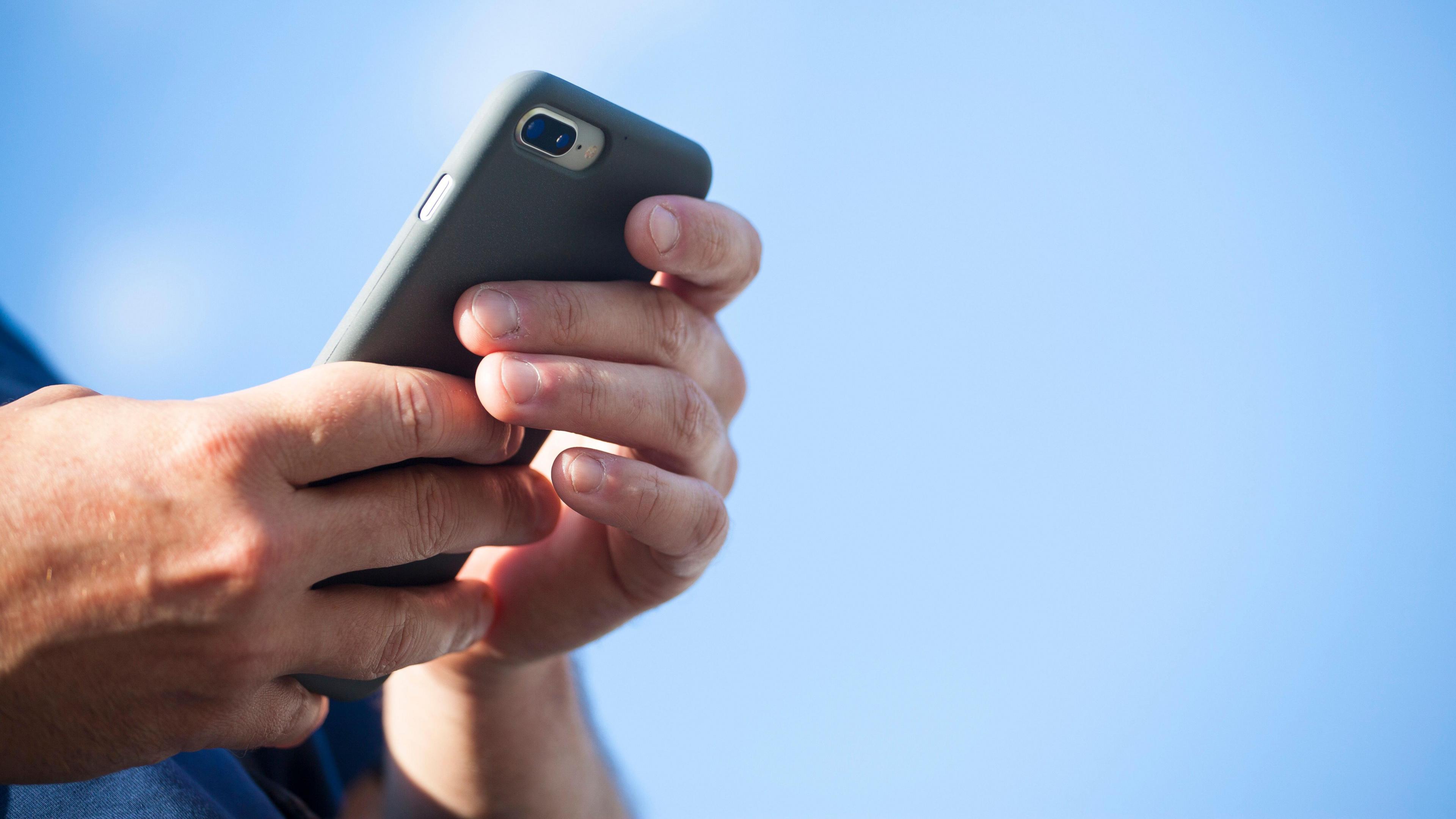 Man texting on mobile phone