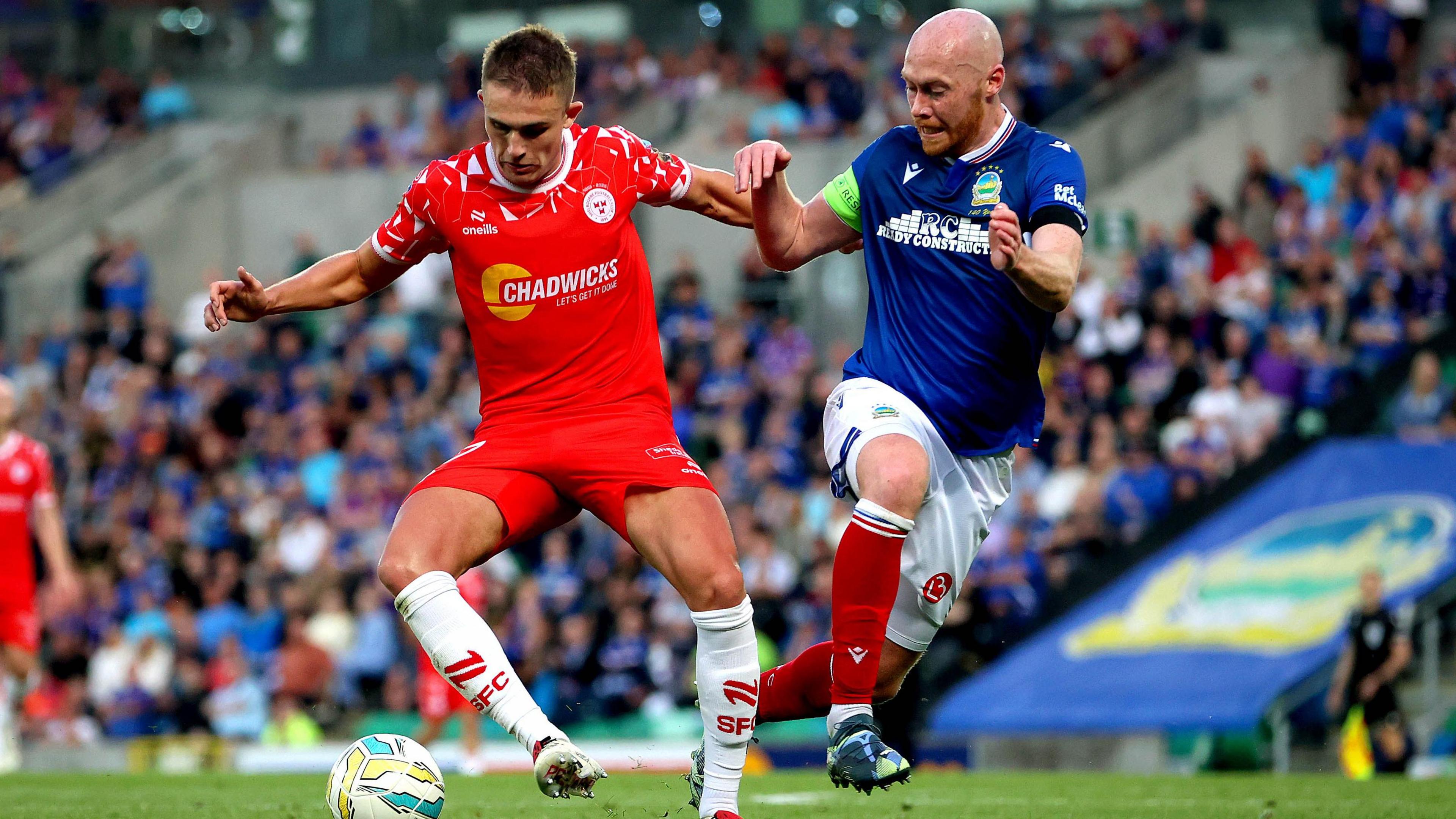Chris Shields challenges for the ball