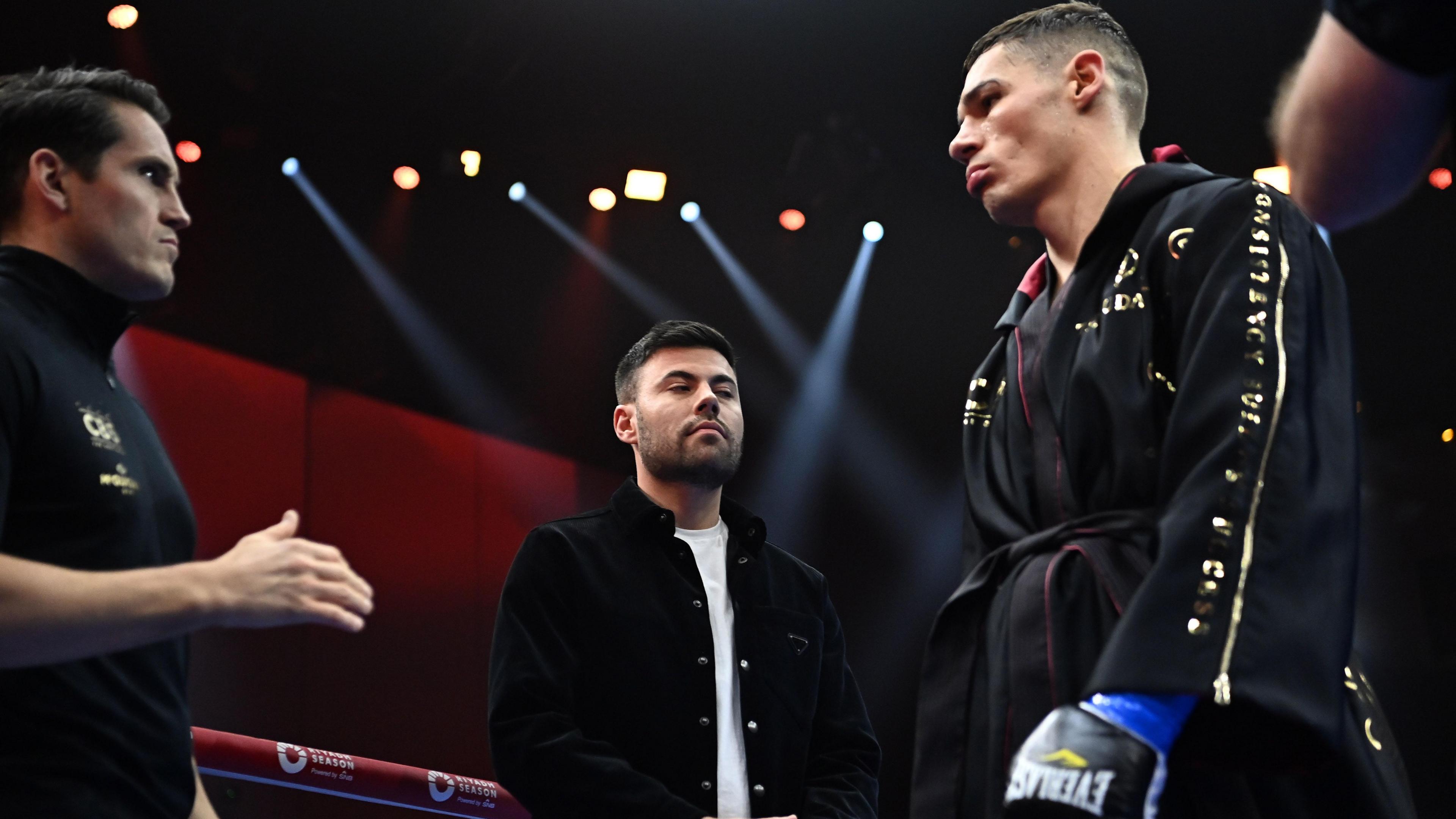 From left to right, Shane McGuigan, Ben Shalom and Chris Billam-Smith stand in the ring at the Venue arena in Saudi Arabia