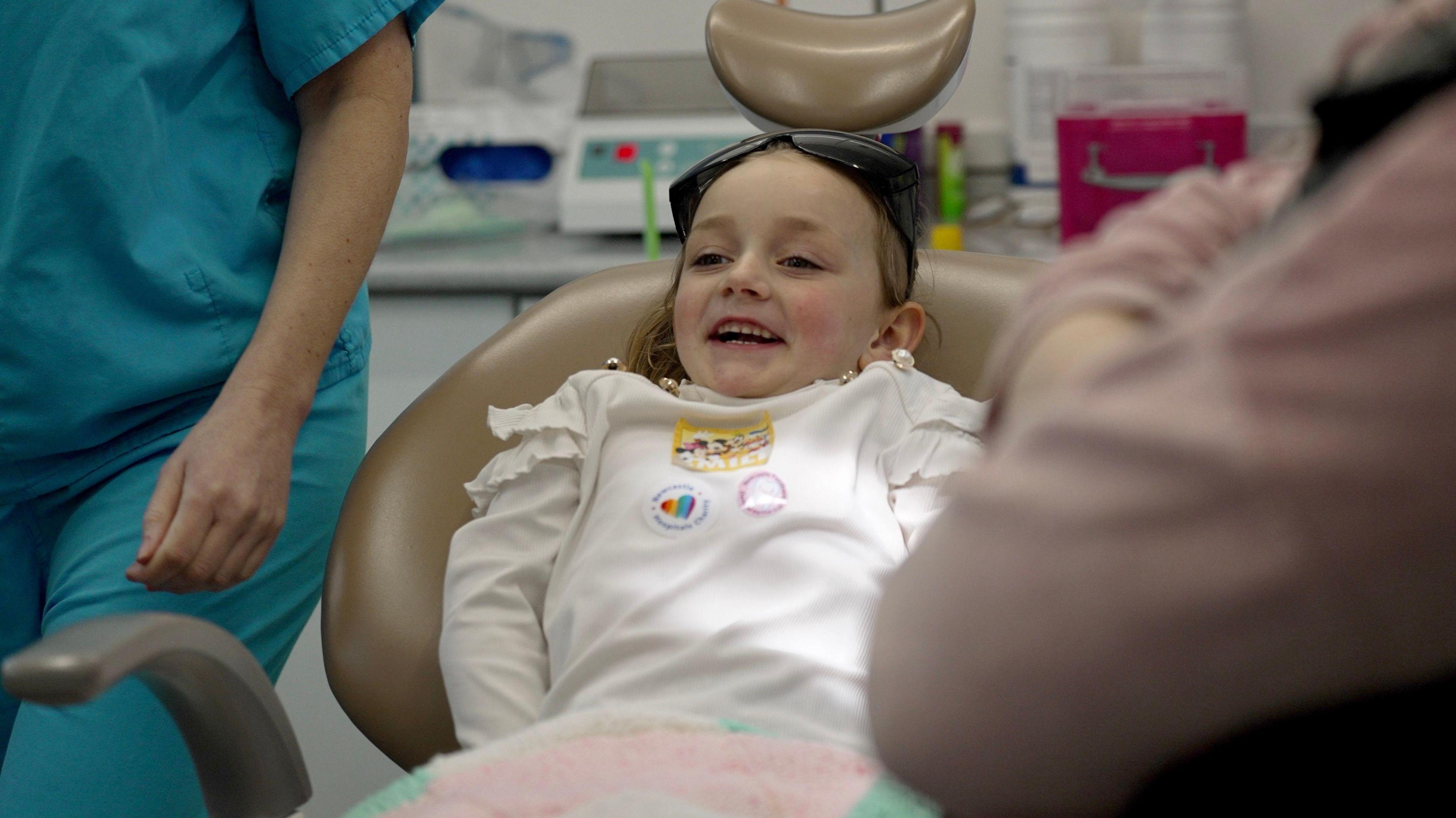 A girl in the dentist's chair