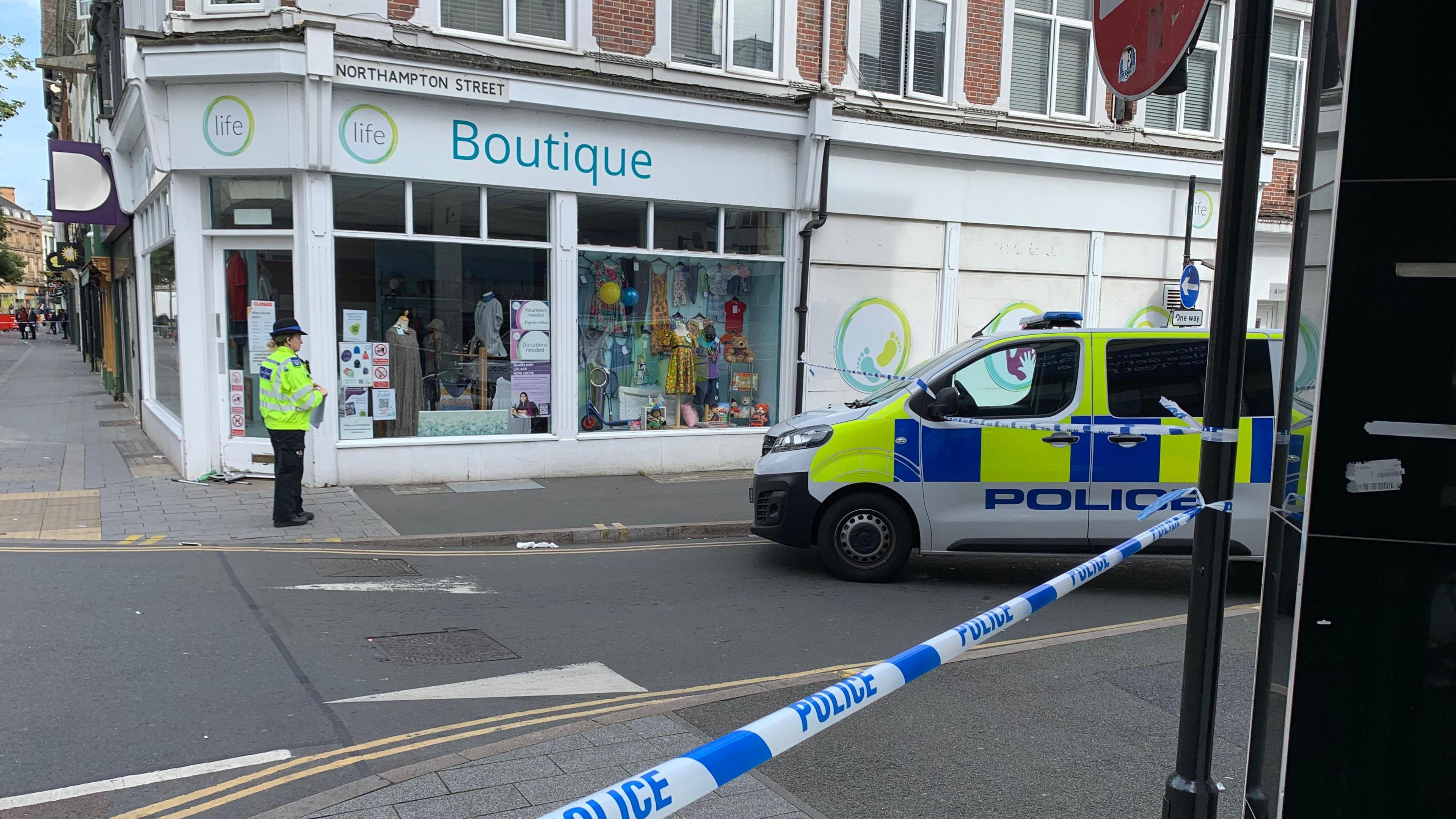 A police van and cordon in Northampton Street